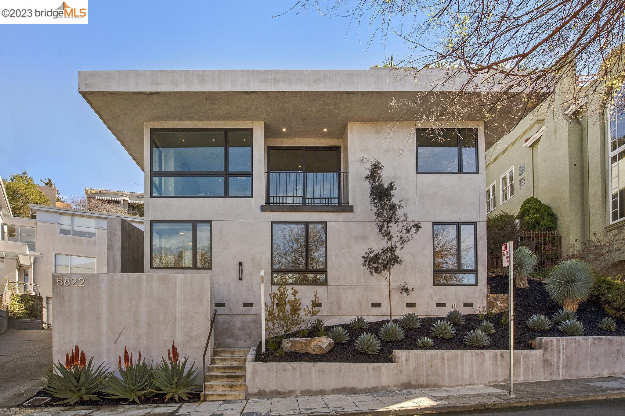 This 2018 Contemporary is a unique confluence of modern luxury, comfort and style. A light-filled spacious open floor plan. Four plus bedrooms, 3 1/2 baths and rooftop deck offering a front room seat to unobstructed views of San Francisco Bay, skyline, Mount Tam and bridges. The main level open floor plan includes a modern chef's kitchen that features an oversized marble island, Thermador appliances, two dishwashers, and abundant storage and walk-in pantry. The courtyard compliments the space for entertaining while adding natural light.  The powder room completes this level.  A large family room leading out to the rooftop deck welcomes you to the upper level.  The primary en suite offers a spa inspired bath and generous walk-in closet. Two additional beds and add’l bath, plus laundry room complete that level. The lower-level retreat with one large bedroom, office, full bath, and a media room with a separate entrance this space is perfect for your guests or au pair. Just a few blocks from Oakland's best shops and restaurants, highways, buses, and Rockridge BART.