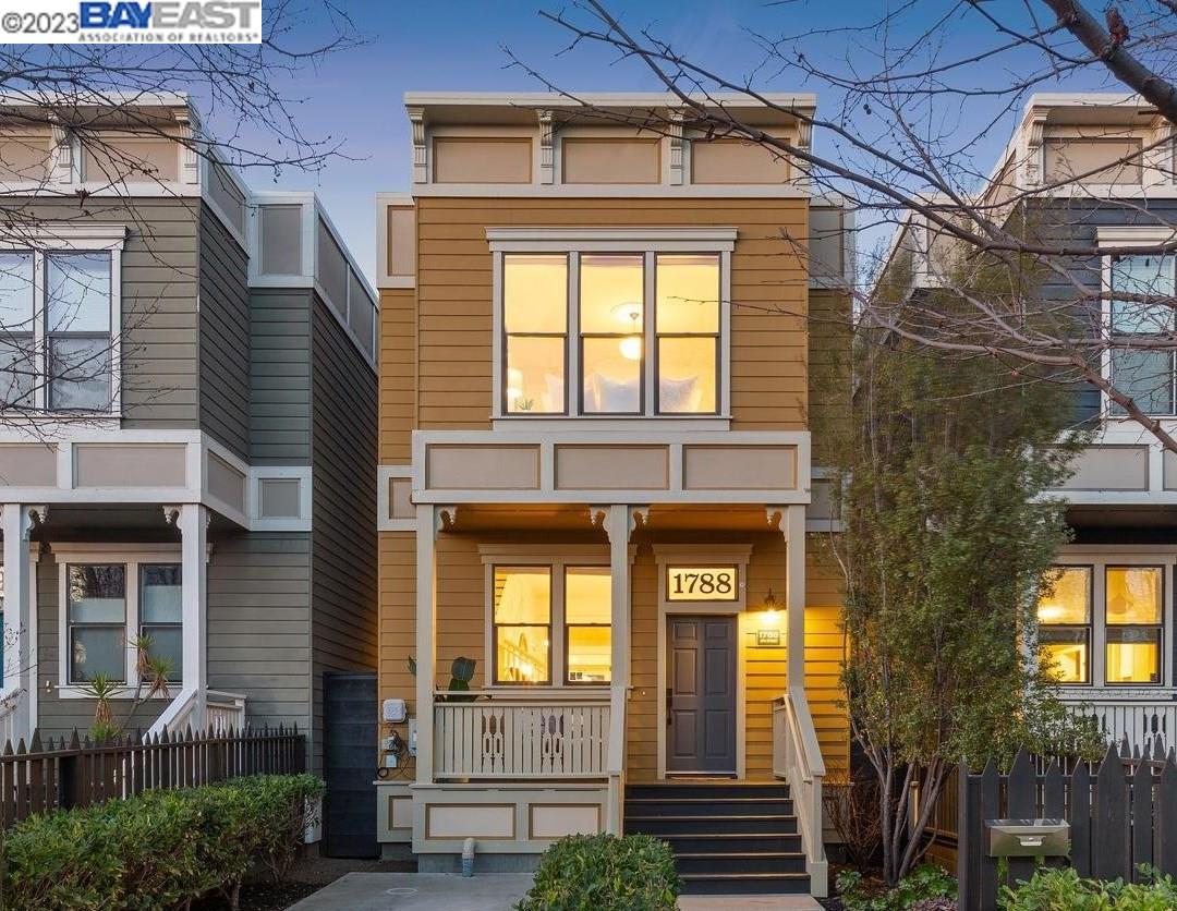 This picturesque 3BD/2.5BA two-story newly built Victorian-style home features 1605 sqft, sun washed rooms, and detailing including overhead lights framed by ceiling medallions, elegant picture frame wainscoting, and rich dark wood floors. Built in 2015 with modern convenience in mind, the open floor plan provides an effortless flow between the living room, kitchen and dining room while oversized windows deliver plenty of natural light. The spacious kitchen contains a gas stove, new dishwasher, and extra cabinet space. French doors lead to an adjacent bonus room – ideal for a breakfast nook or playroom. Bedrooms and full baths are located on the upper level for privacy, featuring crown molding and large sliding door closets. The primary bath enjoys dual sinks, skylight, and shower over a sunken tub – perfect to relieve the stress of a busy day. Also upstairs is a stackable W/D and additional full bath. The rear yard features a verdant lawn and wooden deck with handcrafted wood slab countertop, ready for outdoor cocktails and summer BBQs. This home is tucked on a block surrounded by neighboring renovated Victorian-style homes and charming tree-lined sidewalks. Close to: BART, weekly Farmers Market, Jack London Square, Horn BBQ, and Orbit Coffee.