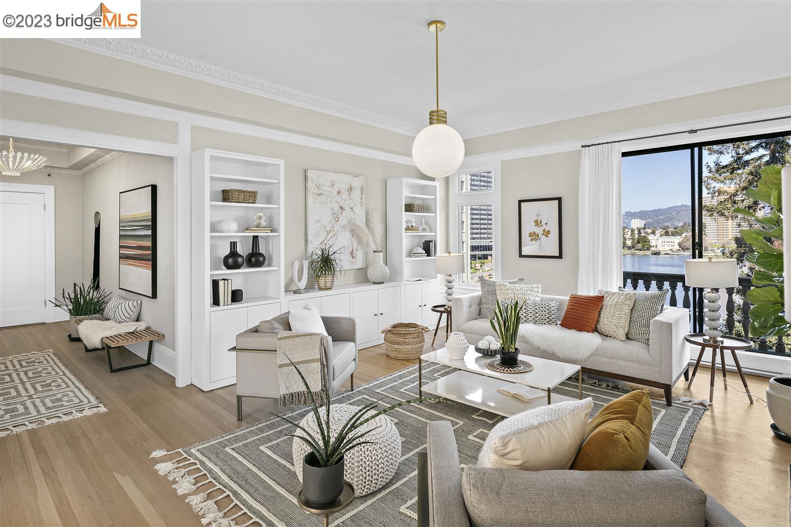 Views, location and elegance are all offered in this stately condo at Oakland's prestigious Regillus on the shores of Lake Merritt! Built in 1924, the historic Regillus is a stunning Beaux Arts residential building filled w/Old World architectural elements & details. Spacious at 1,759 SF, the home is one of only seven 3BR units in the building & features 2BA, formal living/dining rooms, an updated eat-in kitchen & a designated indoor parking space. Located on the 5th floor, the home boasts sweeping Lake Merritt, Oakland city + hills views from light-filled rooms w/10-foot ceilings. Original features include ornate crown moulding, oak floors, an impressive fireplace & handsome stone balustrade balconies visible from most rooms. The building's gracious design includes a circular cobblestone driveway, a spectacular front door & a beautiful private garden + terrace for homeowners & guests. Amenities include an attended reception desk, an elevator, bike room & private storage. Rarely does an Oakland condominium come to market in a building as steeped in Oakland's architectural history as this one. This highly sought-after location offers convenient access to Whole Foods + Trader Joe's, Uptown/Grand Lake restaurants, farmers markets, BART & freeways. Walk Score 97, Transit Score 85!