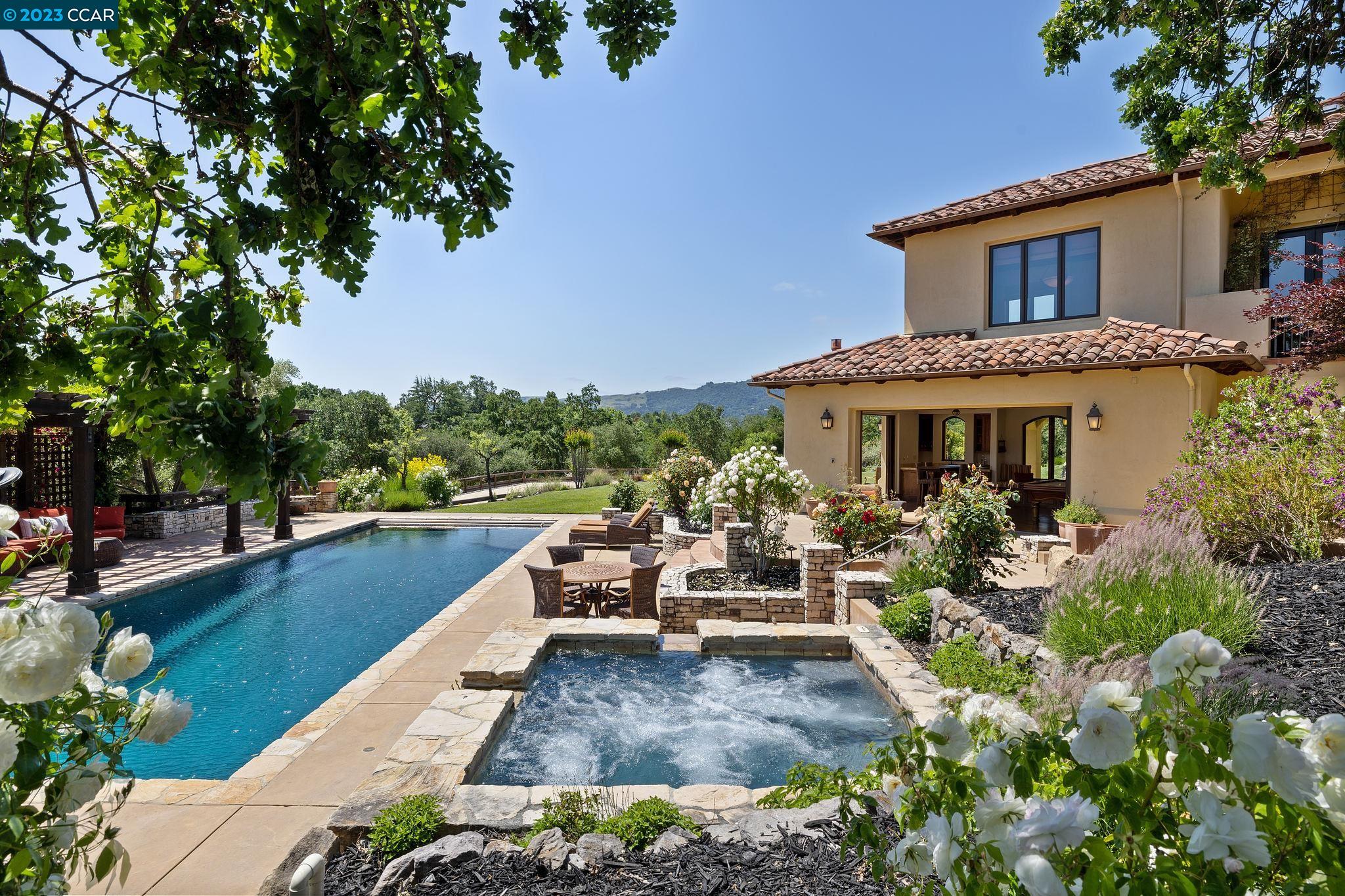 Gated, knoll-top 360° view property, two miles from downtown. Close to 12 years of schools and less than 30 miles from San Francisco and the Silicon Valley. This Kubitschek-designed Santa Barbara style home is a once in a lifetime opportunity unlike anything ever offered for sale in Danville. With almost 3 acres of usable land this setting is spectacular. Custom built to the highest degree of quality, with exposed wood beam ceilings, radius-cornered walls, fabulous walnut and terra cotta tile floors, and gorgeous views from every window. Expansive grassy areas and stone paths lead to a barn, riding arena and horse turnouts with direct access to the Mt. Diablo trail. A 630sf one bedroom in-law unit is just 1 of 1000 reasons to visit this beautiful property that transcends all expectations. Main house: 9076sf 5 beds/2 offices/gym/2 bonus rooms/wine room/5 baths/2 half baths/east and west facing balconies In law: 630sf 1 bed/1 bath/kitchen/living area Barn: 1432sf