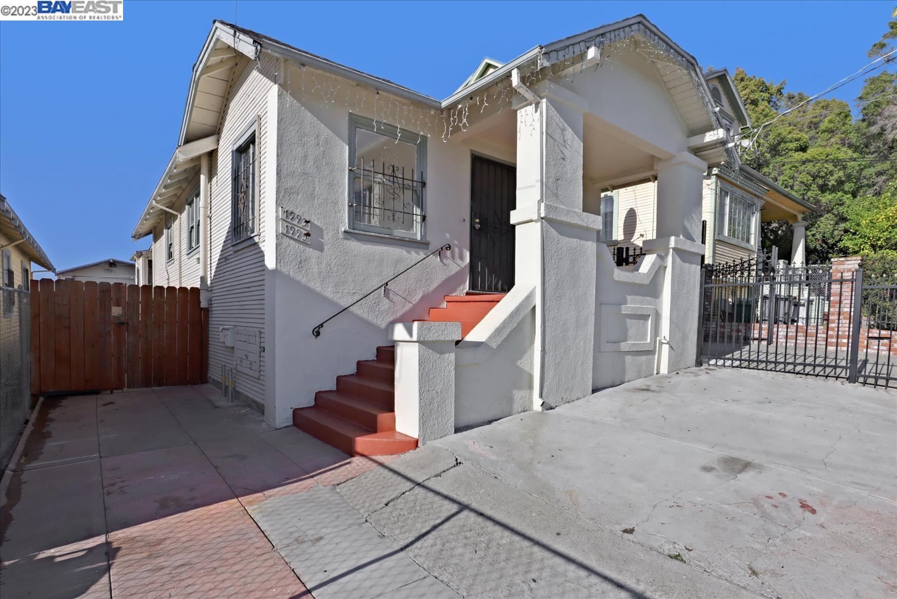 Located in the heart of Bay Area, close to Fruitvale BART station, Peralta District, and Fruitvale district neighborhood. The front unit of the home is a 3-bedroom 1-bath, and the back unit is a 1-bedroom and 1-bath. The sewer lateral is in compliance with building codes. Ideally suited for a buyer looking for a single family home with an added bonus of generating monthly income to go along with their purchase. The larger 3 bedroom and 1 bath unit features carpeting and wood floors throughout the large living space (over 1300 SQF). The kitchen has stainless steel appliances, cabinets, countertops, tile, and lighting to enhance the quality of the space. Kitchen looks out onto and connects to a long driveway and back units. There is hardwood flooring in the living room and dining room of the house. This very large lot of land offers a lot of potential for those who wish to add another unit to it, with a long driveway that can accommodate up to four cars, easy access to the I-580 freeway, and close proximity to multiple markets, shops, and banks.