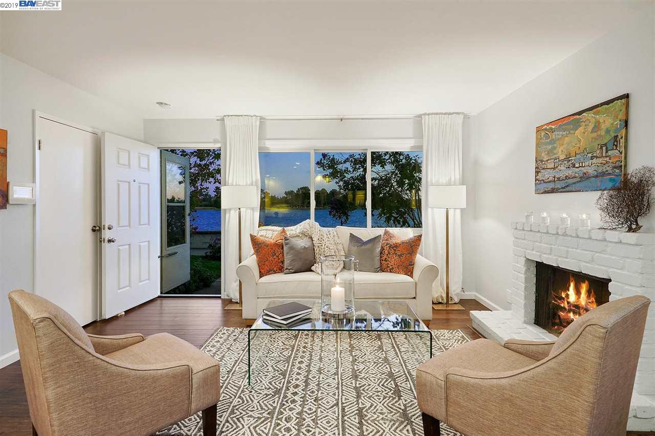 RARE, SINGLE-LEVEL CAPE COD STYLE TOWNHOME ON SF BAY. Its simple architecture with picture windows set against the old seawall and bay make a dreamy combination. Begin each day with sunlight sparkling on the water and end with brilliant evening sunsets. The home's interior is updated in soft grey with white shaker style cabinetry, subway tile and quartz counters for a casual, elegant beach vibe. With the feeling of being far from urban living and more like a quaint village, you step out the front door to the walking and biking trails that follow the shoreline all the way to Crab Cove Beach. A short walk to Park Street shops, restaurants and Alameda's historic movie theater. Close to AC Transit to SF and surrounding areas and the Harbor Bay Ferry with parking.  LOVELY ONE-OF-A-KIND!