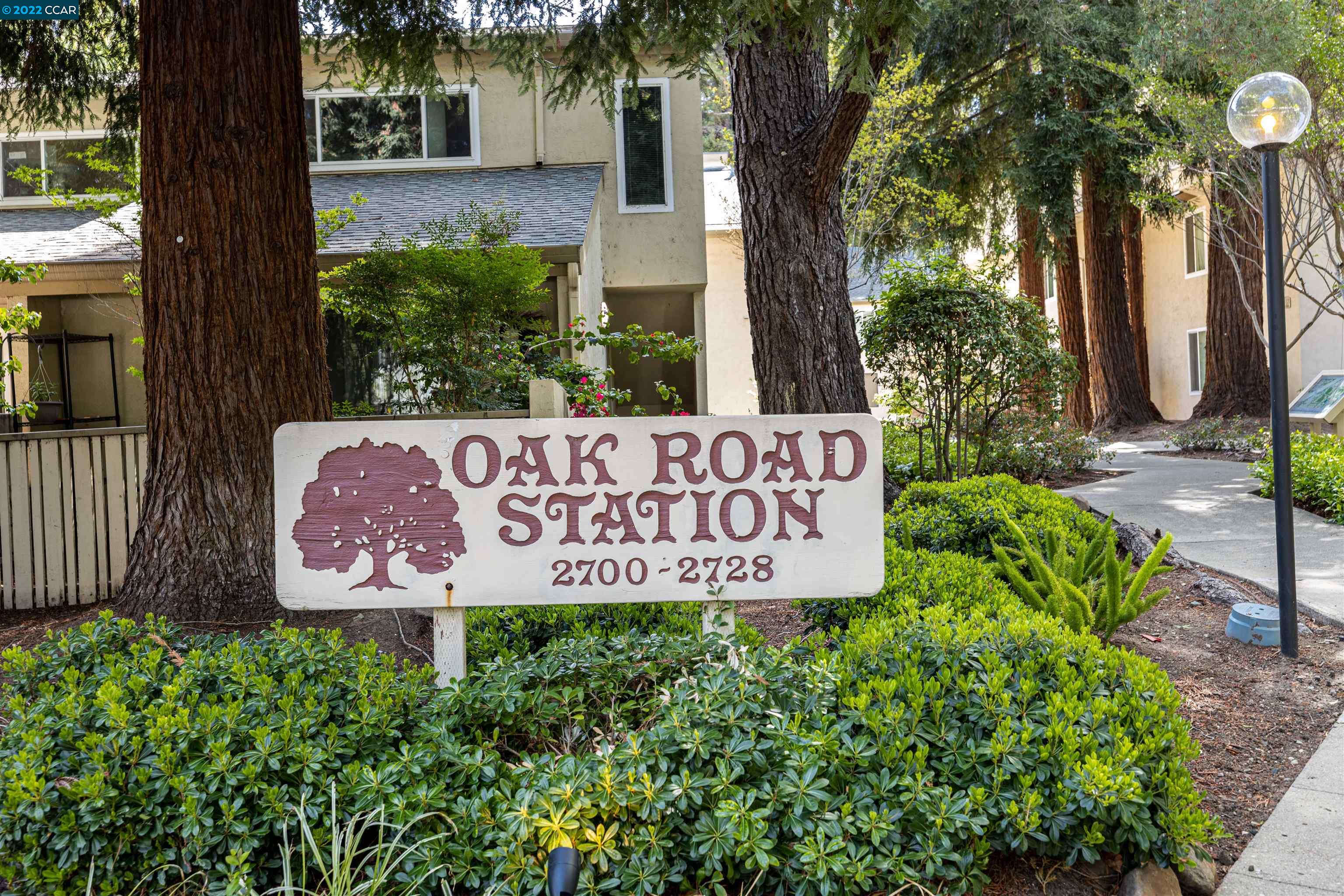 Desired Oak Rd Station in Walnut Creek. Vaulted open wood beam ceilings with redwoods outside make this PRIVATE 2 bedroom condo feel like a cabin style treehouse. Stylish kitchen updated with quartz counters, induction cooktop, s.s. appliances & cafe bar pass through with seating is perfect for entertaining. Serene treetop views from dining & living areas. Access deck for outside dining in nature. Wood lam. plank flooring with designer slate tile flooring in kitchen & bath. Spacious bdrms both with plantation shutters; one with walk-in closet the other a wall of closet doors. Bathroom layout provides a sink vanity with corian countertop separate from the shower/tub/toilet. Secondary spacious walk-in closet or dressing room also featured off the hall. Addt'l storage in deck closet, easy access to covered parking space. Pool, laundry & clubhouse! Steps to the CC Canal Trail & Walden Park. Just minutes to BART, downtown Walnut Creek, shopping & dining. OPEN HOUSE SUNDAY May 22nd - 1-4pm