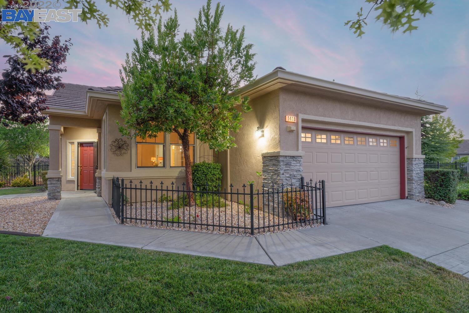 OPEN SATURDAY. Welcome to 1418 Bismarck Ln. in the desirable Summerset 3, gated 55+ active adult community. This lovely Cortland model home is steel framed and features one of the largest lots in Summerset. Private and fully fenced, the surprisingly low maintenance 16,500+ sf yard features many shade trees, a lovely garden area, and private, extended, covered patio with a roll down shade. The freshly painted interior enhances the bright and sunny kitchen with white cabinets, corian countertops, walk-in pantry, breakfast bar, less than one year old refrigerator, and newer dishwasher, gas range, and microwave within the last 5 years. The flexible floor plan takes advantage of the builder’s option for a smart space in lieu of the typical indoor laundry room. A large primary suite hosts a walk-in closet, primary bath with stall shower and privacy glass and dual sink vanity. Visit the Summerset 3 community to see the many amenities it has to offer and… Welcome Home.
