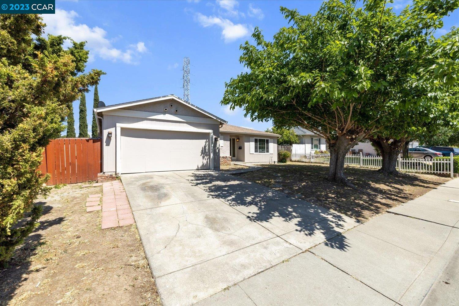 Located in the sought-after Vista Del Rio neighborhood, this newly updated 4-bedroom, 2-bathroom home offers a modern feel with timeless flooring, new carpet  and fresh paint inside and out. Upon entering the home, you'll be greeted by a brightly lit living room and hallway that leads to the bedrooms. Off the entrance is the kitchen with an eat-in dining area perfect for meals and entertaining. The adjacent family room features a tall brick fireplace, ceiling fan, and access to the garage and backyard, adding warmth, coziness, and functionality. All bedrooms have been updated with fresh paint, new carpet, and mirrored closet doors, creating a clean and inviting atmosphere. The renovated bathrooms boast sleek features like new vanity cabinets, white Quartz countertops, vinyl flooring and updated hardware. The spacious backyard offers a clean slate, allowing you to customize it to suit your preferences and accommodate various activities. Residents of this home can easily access a nearby coffee shop for their morning coffee, enjoy various recreational activities at the nearby park, and take advantage of the conveniently located dog park. The home is also located near Foothill Elementary. Don't miss out on the opportunity to own this desirable home.