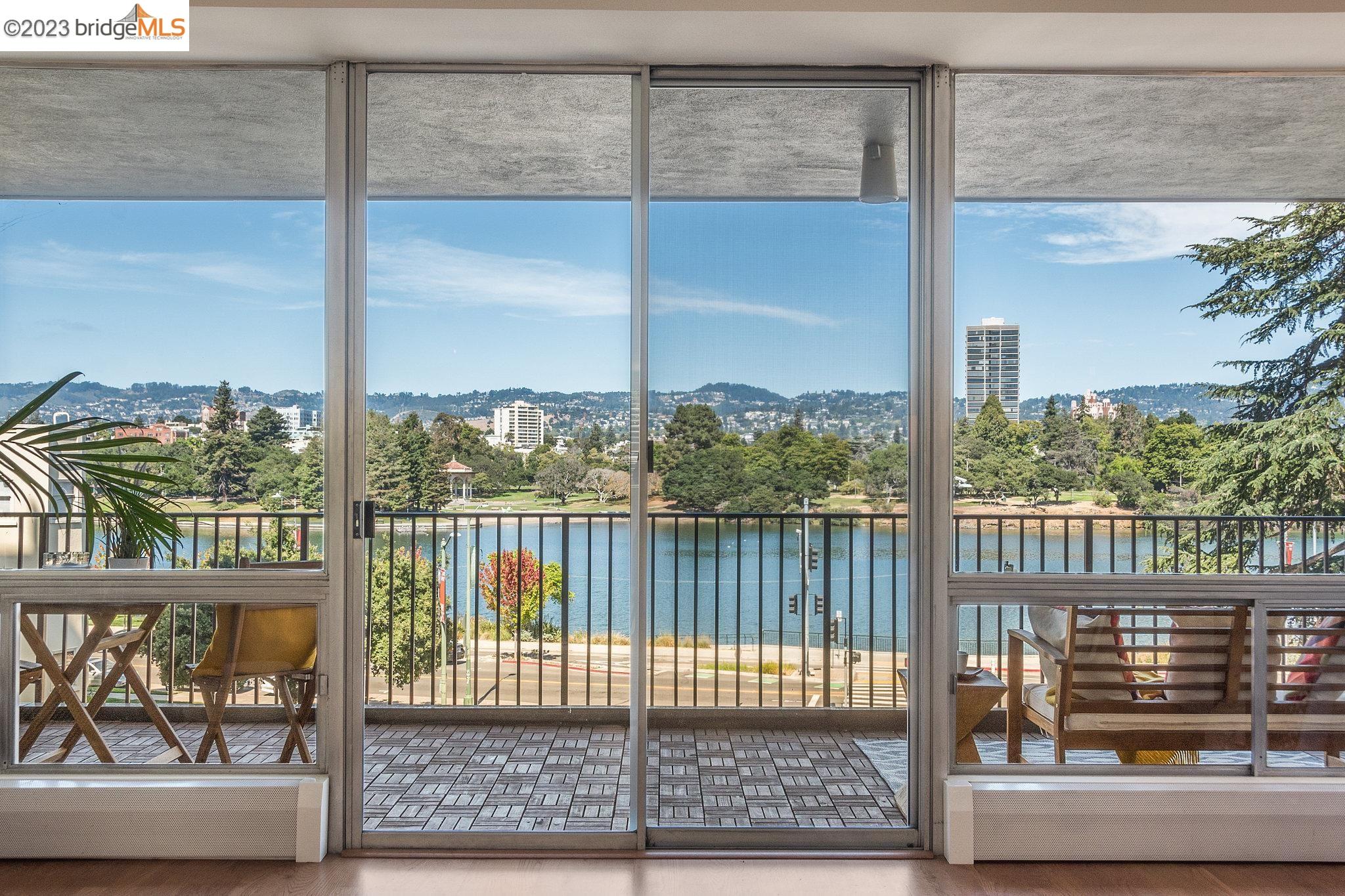 Enjoy the epitome of beauty & brawn in this spacious Lake Royal Co-Op unit. Soak in the simply stunning Lake Merritt views, perfectly framed by walls of glass that fill the spaces with an abundance of light. The expansive 40'+/- balcony spans the length of the unit offering a luxurious extension of the living space, Perfect for al-fresco dining, entertaining, lounging & even gardening. The apartment is tastefully updated throughout. The floorplan boasts a perfect separation of private & public rooms. The entry opens to the generous Living on one side which flows seamlessly into the Formal Dining room on the other that opens to the kitchen. Three bedrooms, including a generous primary suite, are ideally located on the other end offering privacy. The property is located just steps from beautiful Lake Merritt and accessible to BART, bus, entertainment, restaurants, Downtown Oakland, Whole Foods & the Lakeshore District. Secure parking with interior building access & 24-hour doorman. A $9+/- MILLION DOLLAR BUILDING SEISMIC RETROFIT was completed in 2019.  The building offers 2  community spaces for socializing & relaxing. The roof-top deck has panoramic Lake, City & Oakland Hills views & the newly remodeled lower patio is an ideal gathering spot. Truly a special offering & community!