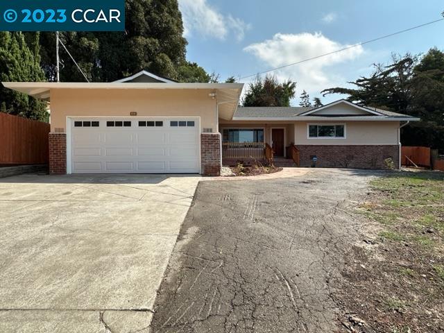 Exceptional Value!! This beautiful 3-bedroom, 2 full bathroom residence offers a perfect Classic mid-century ranch floor plan and many upgrades!! it is nestled on a huge lot and in a serene and secluded neighborhood with the view of El Sobrante Hills from the front-yard & master bedroom! Features include: spacious Large living room/dining area, family room with fireplace & updated kitchen with sleek countertops, white shaker cabinets, new stainless steel appliances & island with ample space and additional seating! Nicely updated bathrooms, the refinished hardwood floor & installation of new hardwood floor with walnut border enhance its inside beauty! Besides two car garage and a large driveway, this house offers an additional parking space for campers, RVs, boats and trailers!! Conveniently located to all amenities.