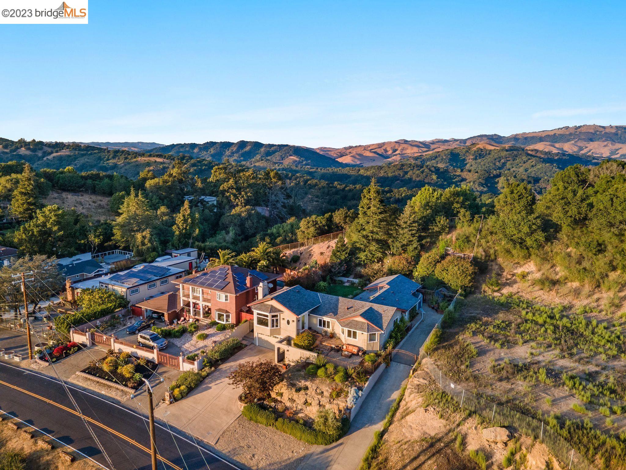 Come discover the allure of this spacious 3 bed 2.5 bath, 2661 Sq Ft, a luxurious gem nestled in the Skyline neighborhood. This captivating property offers a picturesque retreat with breathtaking bay views, lush, minimal water maintenance, native landscaping, and the enchanting presence of hummingbirds dancing amidst the flora. Step into a world of natural abundance featuring a variety of fruit trees, walking up to the fragrance of blooming flowers, all right in your backyard. A unique balance of privacy and accessibility, close to Goldenrod Trail and Anthony Chabot regional park. This elegant home combines comfort, style and sophistication. Stepping onto the property, your eyes will be drown to the soaring ceilings, tranquil waters under the warm sun, seamless indoor outdoor flow and natural light, airy and inviting ambiance of the open kitchen, integrates with the dining and living areas, perfect for modern living.Convenient location for commuting and enjoyable living. Don't miss out on this piece of paradise!