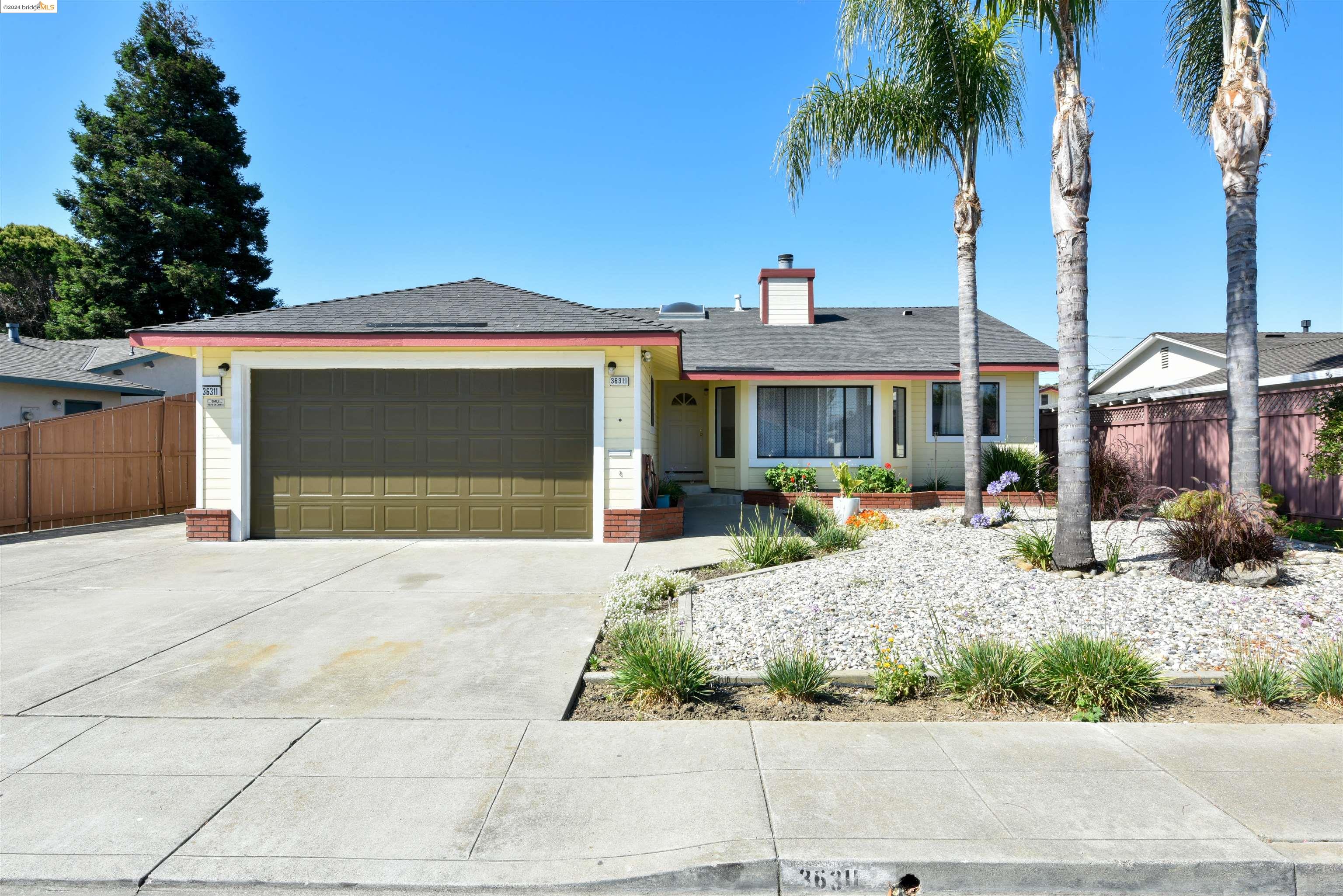 Rare Opportunity to own 5 well-maintained living Areas on one Lot in Fremont. May be for Inlaws*, Child Care*. The Main Front House 1794 ft custom build 1986, featuring 3 BD RMS /2BD RMS/FA RM /gourmet kitchen/Formal LIV RM /gas fireplace /remodeled BA RMS / 2 Car GA/ open layout, high vauted cellings /3Bay Windows /2 Sky lights/ Celling Fire Sprinklers*/ Solar Electric System/   .with a Fire Sprinkler* System.  Also has a Solar 49 Panels.*/ In 1999 an addition of 1994 ft was added to the Original House.With 3 BD RMS.,3 LIV RMS.,3 BA RMS., and a 1 Car Ga,.Connected with Corridoors . And a  600ft Guest House Detached BLDG was Added, 1 BDRM, 1DEN/Office/ LIVRM and Kichened. This Buildings Name  may be Chanched to ADU?