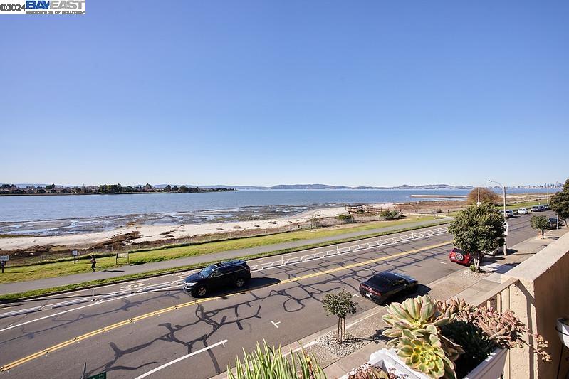 Enjoy SF Bay views and patio access from this ground floor unit. This spacious and private home is a serene and welcoming waterfront retreat. Enjoy entertaining in this comfortable home and relax in your living room or primary bedroom both of which have sliding glass doors to enjoy your view of  the SF bay. This two bedroom, two bathroom home is an ideal location close to stores and dining in South Shore Center, across from a bird sanctuary and steps from Alameda Beach. Come and experience the unparalleled Bay views.