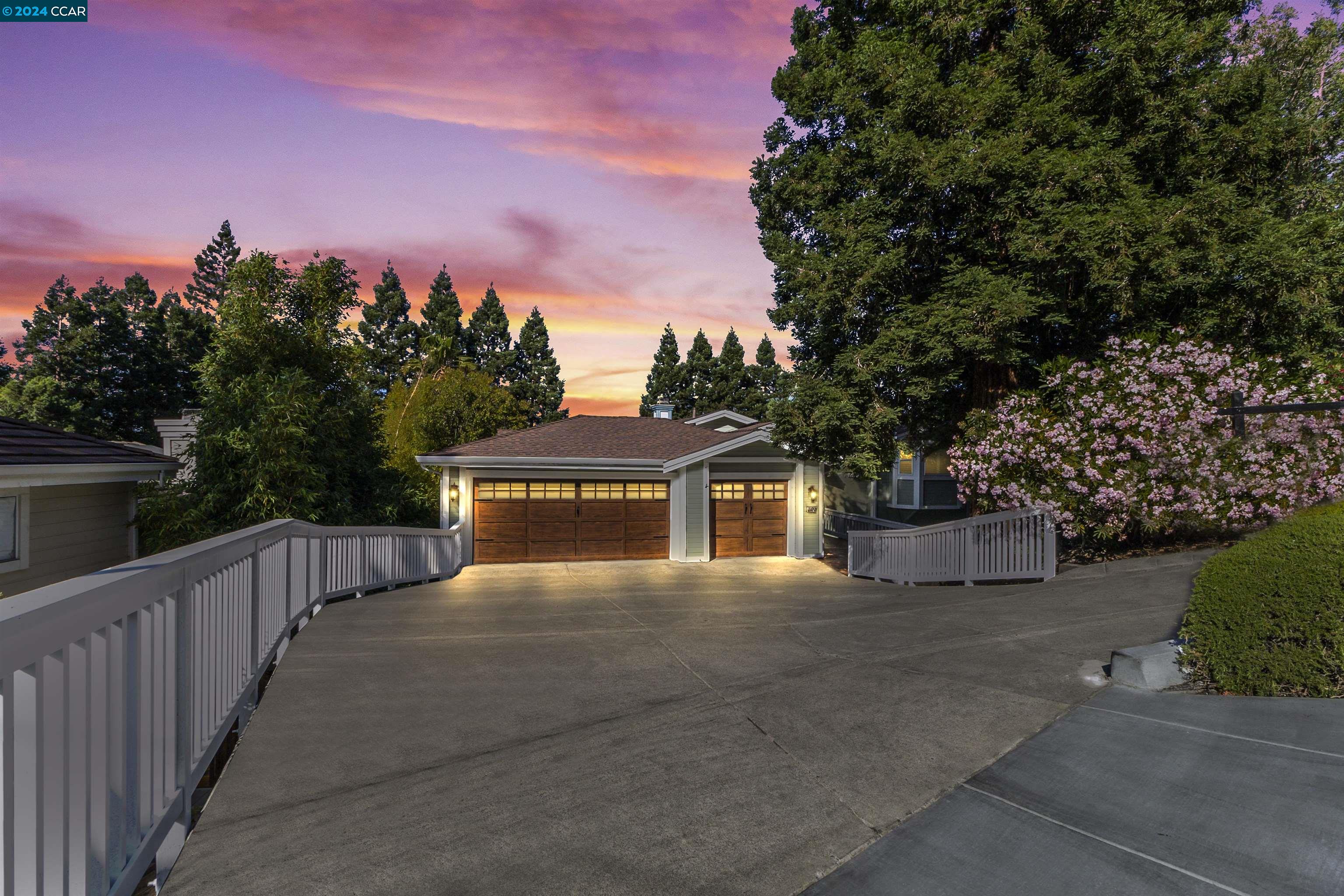 Nestled in Walnut Creek's serene hills, 2420 Overlook Drive offers modern luxury and stunning Mount Diablo views. The open-concept living space boasts soaring ceilings and abundant natural light. A chef's kitchen with sub zero fridge and thermador appliances, master suite with cozy fireplace and spa like bath. Dual living spaces and a dedicated home office provide comfort and convenience for the whole family. Outside, two expansive decks provide endless opportunity for entertaining as well as a level grassy area for gardening or play. A separate entrance 1 BR ADU allows for multi-generational living or income producing potential! Located near transportation, top-rated Walnut Creek schools and outdoor recreation, this home embodies California living at its finest. Schedule your showing today and experience the epitome of tranquility in this executive estate!