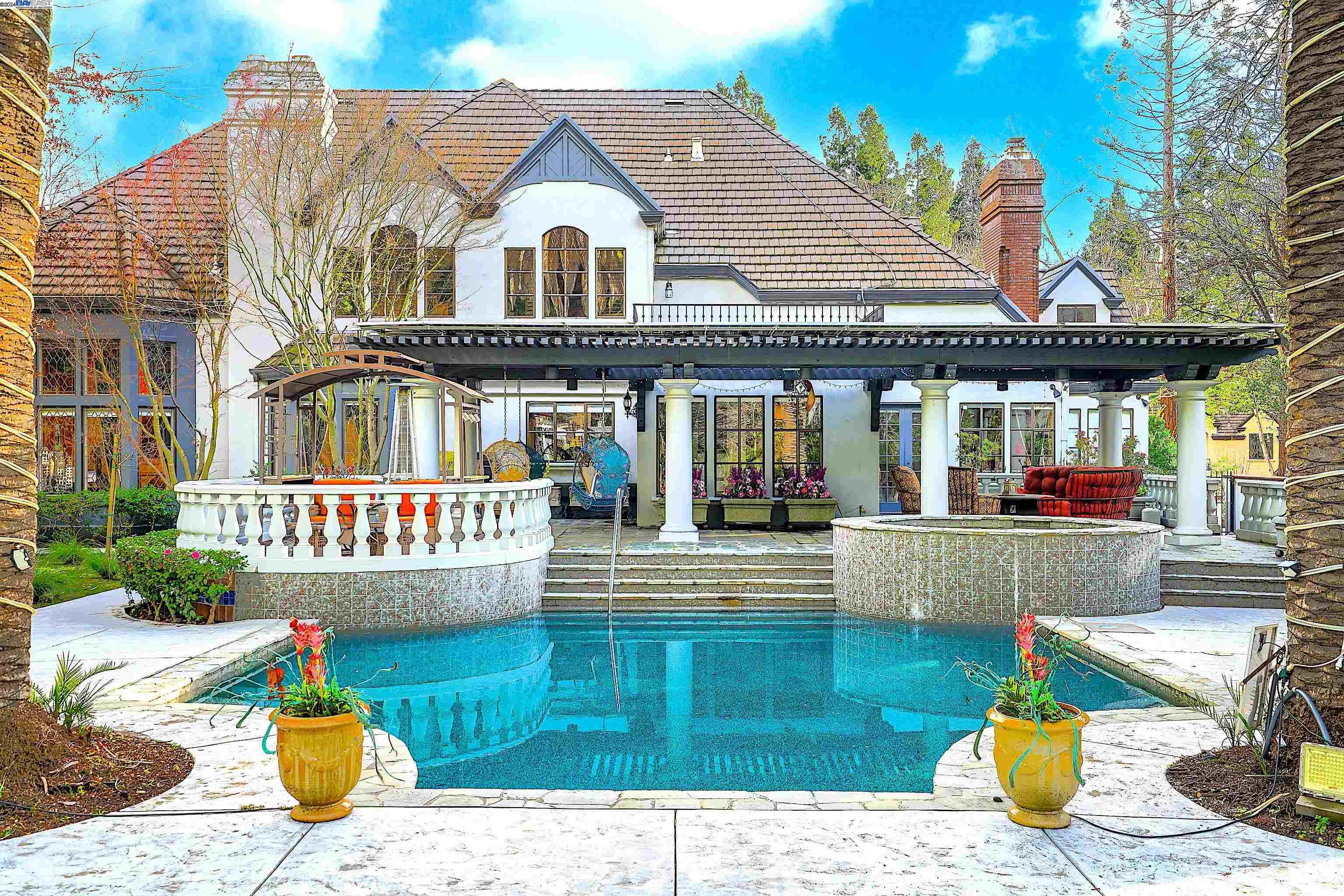 Beautiful BlackHawk Corner House. A magnificent five-bedroom home that epitomizes luxury and sophistication. Each bedroom features a spacious walk-in closet and an ensuite bath, ensuring both comfort and convenience. The grand ceilings and Roman-style colonnades add a touch of classical elegance throughout the home. The kitchen is a chef's dream, boasting quartz countertops, elegant soft-close cabinetry with integrated lighting, and a stylish tile backsplash. Adjacent to the kitchen, a cozy breakfast nook provides the perfect spot for morning coffee. This home offers a variety of entertainment spaces, including an expansive dining room and a welcoming living room. The game/bonus room is equipped with built-in shelving, a wet bar, a fireplace, and a balcony, making it ideal for gatherings and leisure activities. The serene backyard offers a tranquil retreat, while the corner location ensures privacy and quiet. With many balconies and six fireplaces, this home is designed for both relaxation and impressive entertaining. Located near top-rated schools, this property is ideal for families seeking a wonderful location and a lifestyle of unmatched serenity and convenience. Open House on July 21st from 1:00 PM to 4:00 PM.
