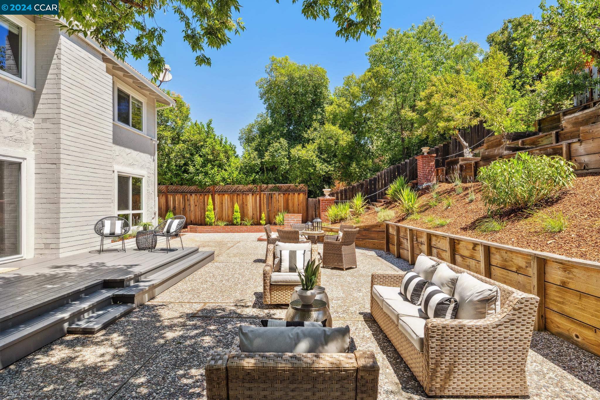 Never on the market before, this fabulous two-story home located in the  sought-after WC neighborhood of Rudgear Meadows. W/a generous 2,510 +/- SF of living space, this home offers 4 beds and 2.5 baths and wonderful gardens, all set on a .19-acre lot. With open floor plan & soaring ceilings, large picture windows tons of natural light, 3 wood burning fireplaces, new carpet & vinyl flooring, updated recessed &  decorative lighting, this home leaves nothing to be desire! Formal living & dining rooms feature wood-burning fireplace w architectural details, large picture windows w/views of gardens  sets the stage for formal entertaining.  Included on the entry level is the spacious kitchen/great room. Updated eat-in kitchen with bright white cabinets, quartz countertops, stainless steel appliances, large picture window w views of garden. Spacious family room offers ample space to relax & retreat. The indoor-outdoor flow of this home is exceptional. Large deck offers counter seating &  pass-through window, perfect for al fresco dining. Spacious patios provide outdoor living /eating areas for relaxation, socializing, & play space. Terraced garden offers fruit trees, vines, & plenty of space for veggie garden.  Close to commute routes, parks, trials and HOA pool. Top Schools!