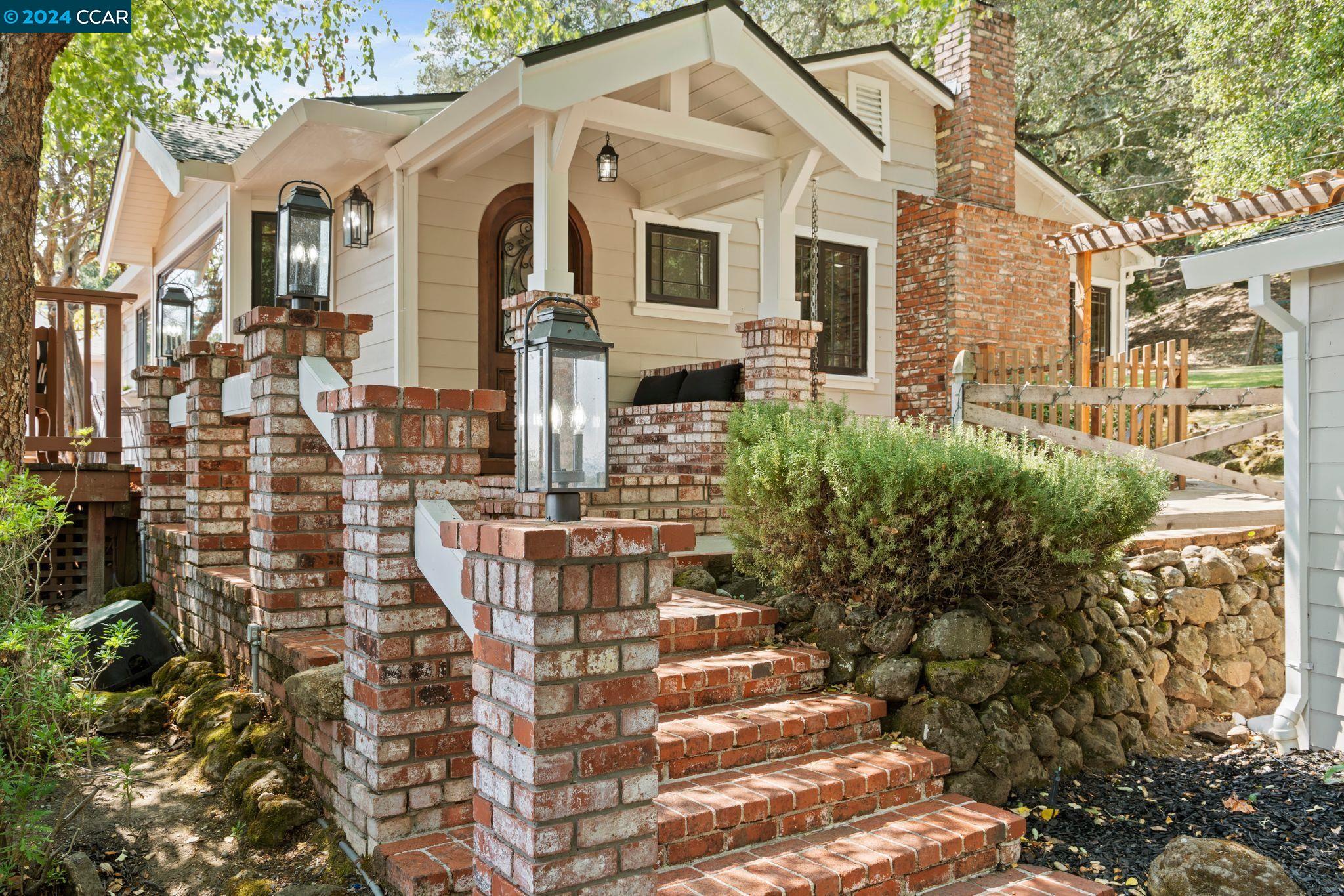 Prepare to fall in love with this stunning, completely renovated estate in Danville's sought after West Side. Tucked along a private road dotted with oak trees, this two-level home has been extensively renovated to create the turnkey home of your dreams. The heart of the home is the multi-functional great room, featuring a stunning kitchen, light-filled dining area, and spacious living room. The home is designed for hosting events indoors and outdoors, flowing to multiple outdoor patios in the front and back perfect for entertaining and dining al fresco. Renovated in 2024, the home features vaulted ceilings, multiple built-ins and hickory flooring.  The incredible 4.42 acre lot offers a stay-at-home oasis, with a large built in fire pit, pickleball ready sport court, and room for expansive gardens.  Deluxe 3-car garage, circular driveway provides room for multiple cars and recreational vehicles.  An Accessory Dwelling Unit adjacent to the residence features two rooms and a workshop.  Experience the magic of west side Danville in this move-in-ready property!