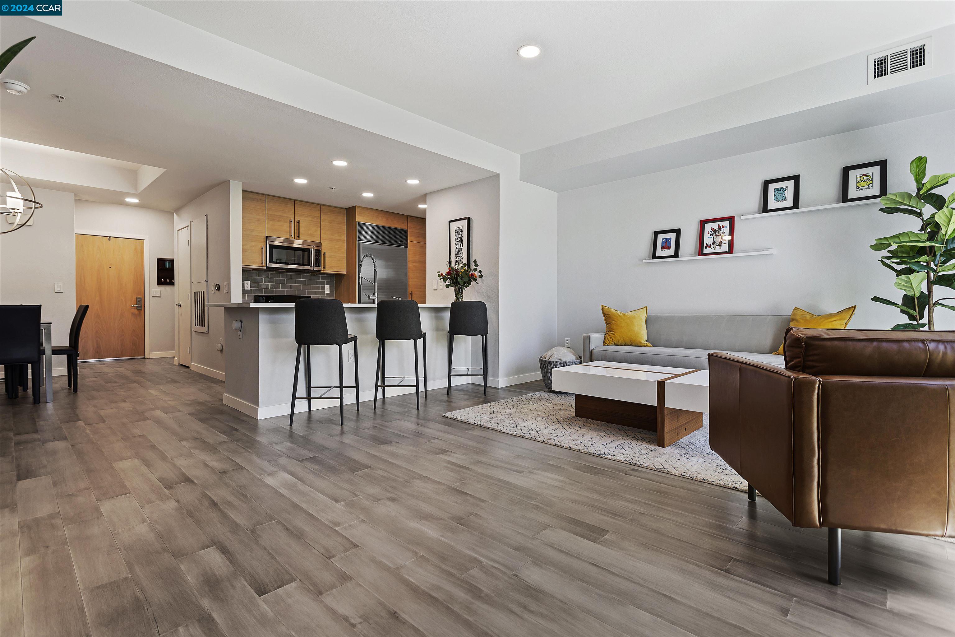 This 1.5-bedroom beauty offers an updated modern kitchen, vaulted ceilings, premium flooring, a large primary with ensuite and a den. Let’s not forget the floor to ceiling windows and a deeded secure parking spot and storage. Enjoy the community pool, recreation area, gym and other amenities that The Mercer has to offer. Just minutes away from shopping, parks, BART, freeway access and more - urban living in the heart of Walnut Creek! Downtown living at your doorstep.