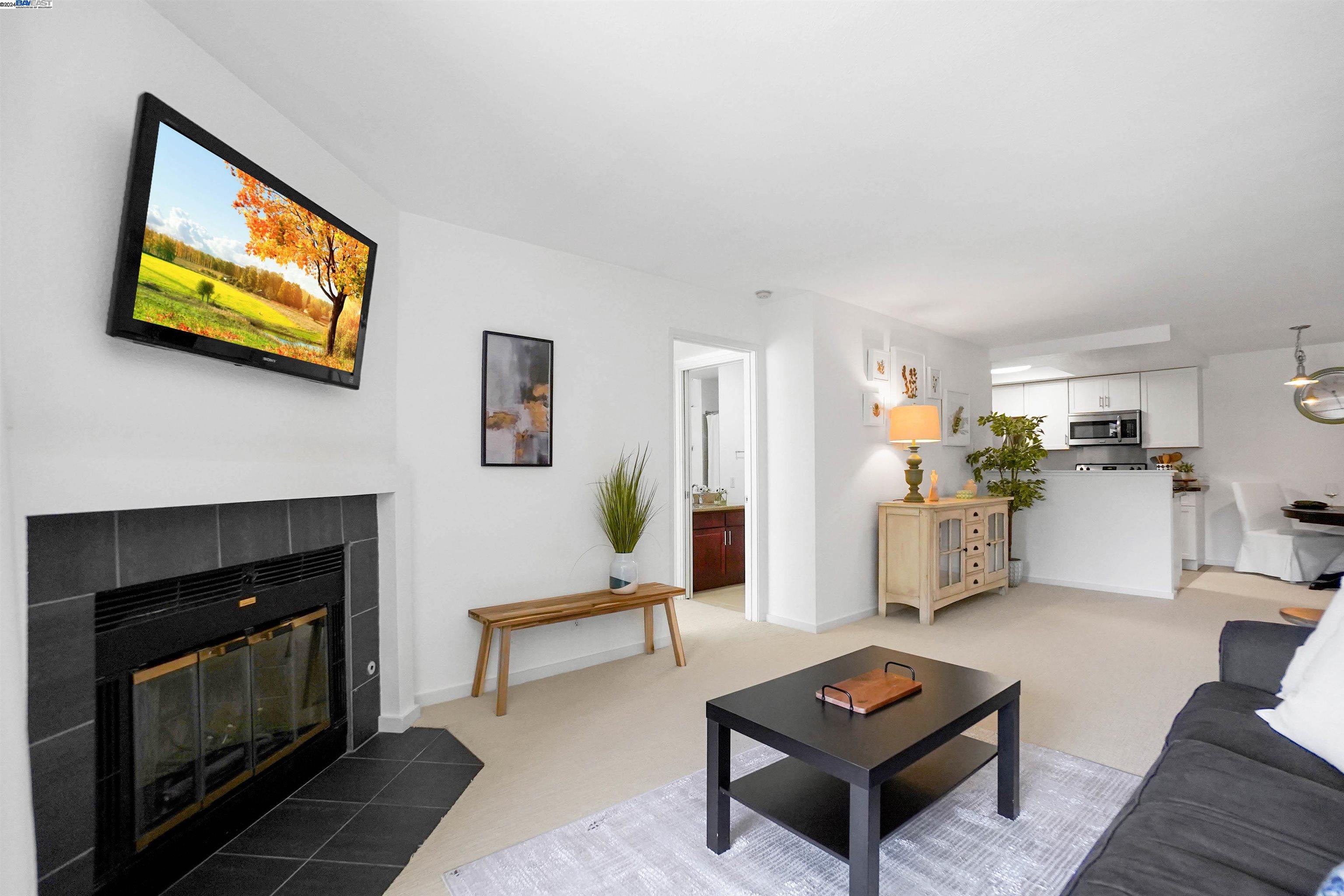 Experience urban luxury in this stunning 2-bedroom, 2-bathroom condominium located at 1318 B St in downtown Hayward. Situated on the first floor, this residence boasts a cozy fireplace, convenient in-unit laundry facilities, a spacious patio, elegant countertops and the added convenience of two underground parking spaces #112 and #131 (closest spot to elevator).  Indulge in a vibrant lifestyle with a plethora of eateries and shops just blocks away. Commuting is a breeze with easy freeway access and two nearby BART Stations. Residents can also take advantage of building amenities including elevators, a secure lobby, a refreshing heated pool, a well-equipped gym, and pet-friendly courtyards.  It also includes a storage unit in the underground secured parking area.  With an impressive Walk Score of 91, this condo is nestled amidst restaurants, shops, and the serene beauty of Hayward Japanese Gardens. Additionally, it offers convenient access to Oakland Airport, Oakland Zoo, and picturesque parks.  Located in Midtown at Hayward, this property boasts a prime location, just 35 minutes from downtown San Francisco and 34 minutes from Silicon Valley. Whether you're seeking a starter home, downsizing, or considering an investment property, this condominium is an excellent choice.