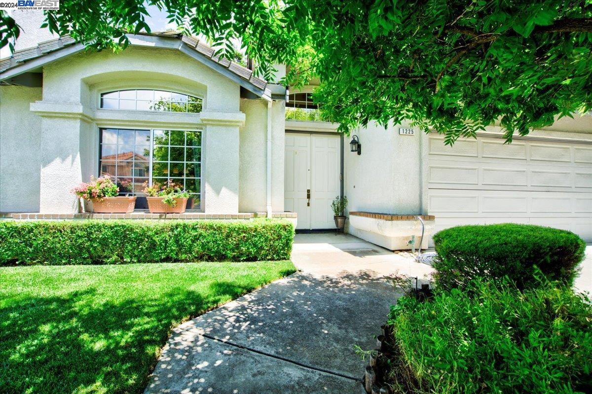 Welcome to this quiet, charming neighborhood known for its long-term residents, holiday light displays, and walk-friendly streets. Steps to the vibrant downtown, library, trails, and award-winning wineries. This home feels and lives larger due to its vaulted ceiling, designer color palette and open floor plan. Crown molding featured throughout and upscale wall paneling included in hallways. Updated kitchen has a large island, stainless steel appliances, and granite counter tops, all adding to its modern appeal. There are two fireplaces to enhance entertaining family and friends. Primary ensuite bathroom has large soaking tub and extra walk-in closet.  Downstairs features one bedroom and a full bath. Backyard has newly remodeled deck and shed has extra space for storage. Come take a look!