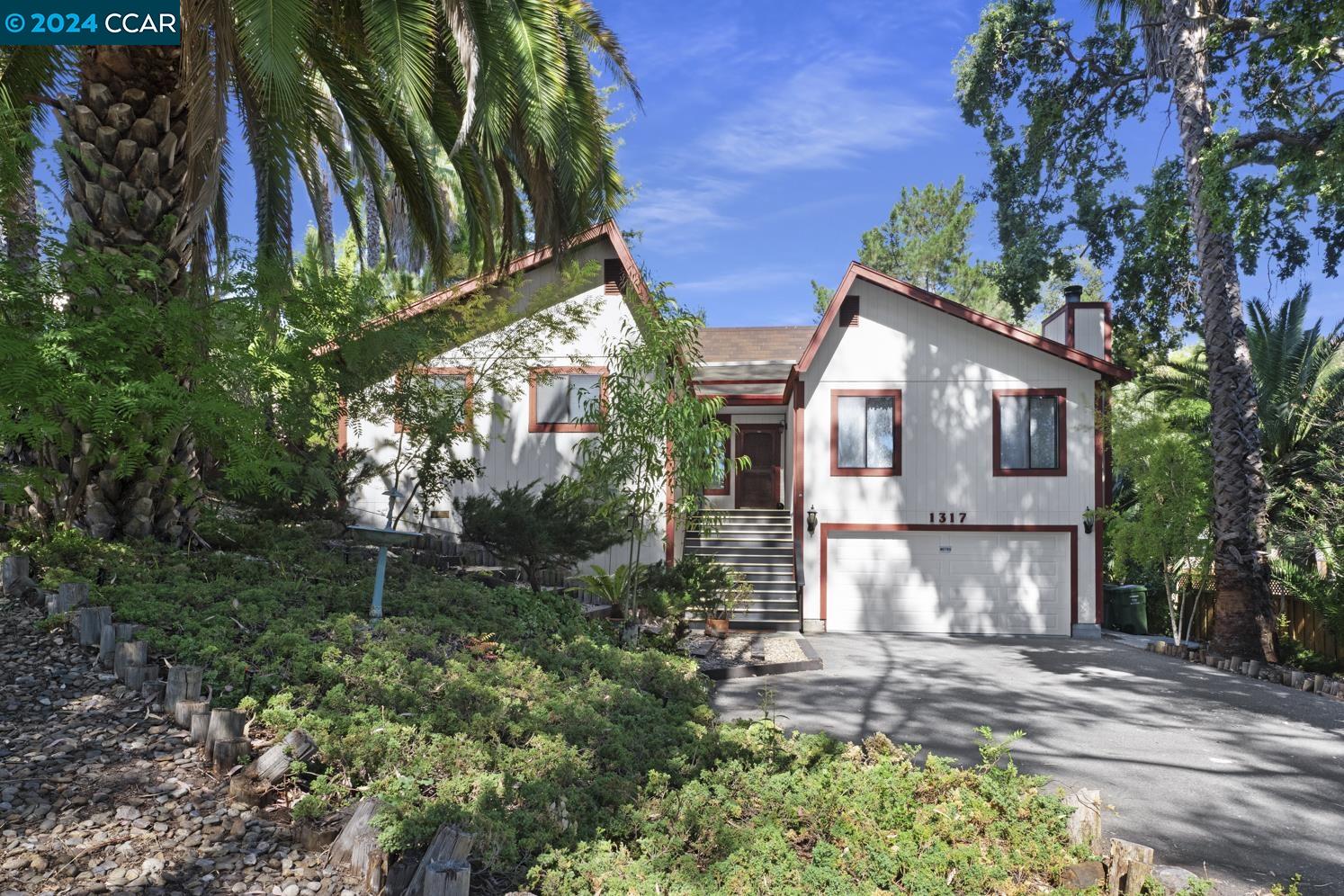 If PRIVACY is important - this property is for you!! The 2,158 sq ft two-story 4-bedroom, 2-bathroom home is bright & airy, nestled on a private lane in sought-after area of Walnut Creek. Built in 1984 by Executive Builders, this  home sits on an expansive 18,150 sq ft lot that could potentially accommodate an ADU. The spacious living room features a vaulted ceiling,  & a stone wood-burning fireplace. The kitchen has a breakfast bar, bay window, and opens to the dining area. Primary bedroom offers a retreat with its own en-suite bathroom and spacious walk-in closet. Two more bedrooms on the main level provide ample space and located next to guest bath.  The fourth room is located downstairs and is versatile, ideal for an office, second living room or workout space. It has its own private entrance leading out to the backyard. A large deck overlooks the secluded backyard with mature landscaping & trees. The property is serviced by a newly installed automatic sprinkler system.  The home also includes a new Carrier HVAC system & new water heater.  Located within a highly desirable school district & just minutes from downtown, shopping centers, restaurants, and major freeways. Yes, you are close to Bart - you can see and hear Bart in front yard, but neighbors say they don't mind.