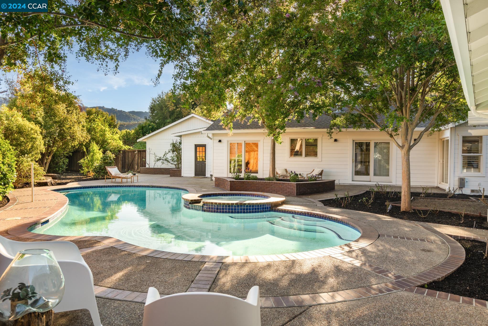 Charming single-story plus ADU, pool & spa on large flat lot in Westside Alamo! Fresh white exterior & welcoming front porch lead to the 2 bed & 2 bath main house on private court location surrounded by lush, mature landscaping. Inside find a bright & airy interior with great room, high ceilings, and rich mahogany & slate flooring add an elegant touch. Adjacent dining area flows seamlessly into large galley kitchen. Newly refinished cabinets, ample storage, gas range & cozy nook for casual dining. Well-appointed hall bathroom, a secondary bedroom, and a luxurious primary bedroom with an ensuite bathroom. An additional 90 sq foot flex space not included in sq. footage which can be used as an office or retreat. Outside, the backyard is an entertainer's dream. Large sparkling pool & a versatile one-bedroom ADU, complete with its own kitchen, bathroom, air conditioning, and laundry. This space is perfect for a home office, guest accommodation, independent living area, or short/long term rental. Oversized 3-car garage has a 2-story foundation for future expansion. Ideally situated near top-rated schools, shopping centers, & with easy freeway access, this home combines comfort, style, and convenience. (Main house & ADU sq ft and bed/bath count combined).