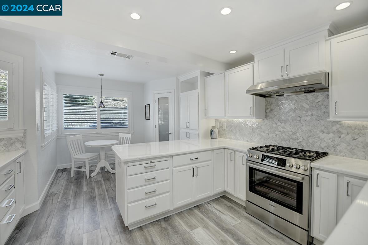 Step into luxury refined in this gorgeous remodeled light and bright Magnolia Condominium in prestigious Deer Highlands neighborhood of Rossmoor. Offering 2 bedrooms, 2 bathrooms, Den/Office all beautifully laid out in over 1,500 sf of living space. Expansive eat in kitchen with storage galore has been recently remodeled with quartz countertops, high end appliances and a rare walk in pantry perfect for all your culinary needs. Open airy floorplan with vaulted ceilings, loads of windows, georgeous new fireplace mantle and hearth, two sliding glass doors that lead to spacious deck with 10+ views. This lovely home also features a primary bedroom suite with ample closet space and custom organizers, and updated primary bath, guest bedroom with full guest bath, separate laundry room, and a formal entry foyer to complete the list. Convenient Garage parking and plenty of guest parking. The Best of the Best!