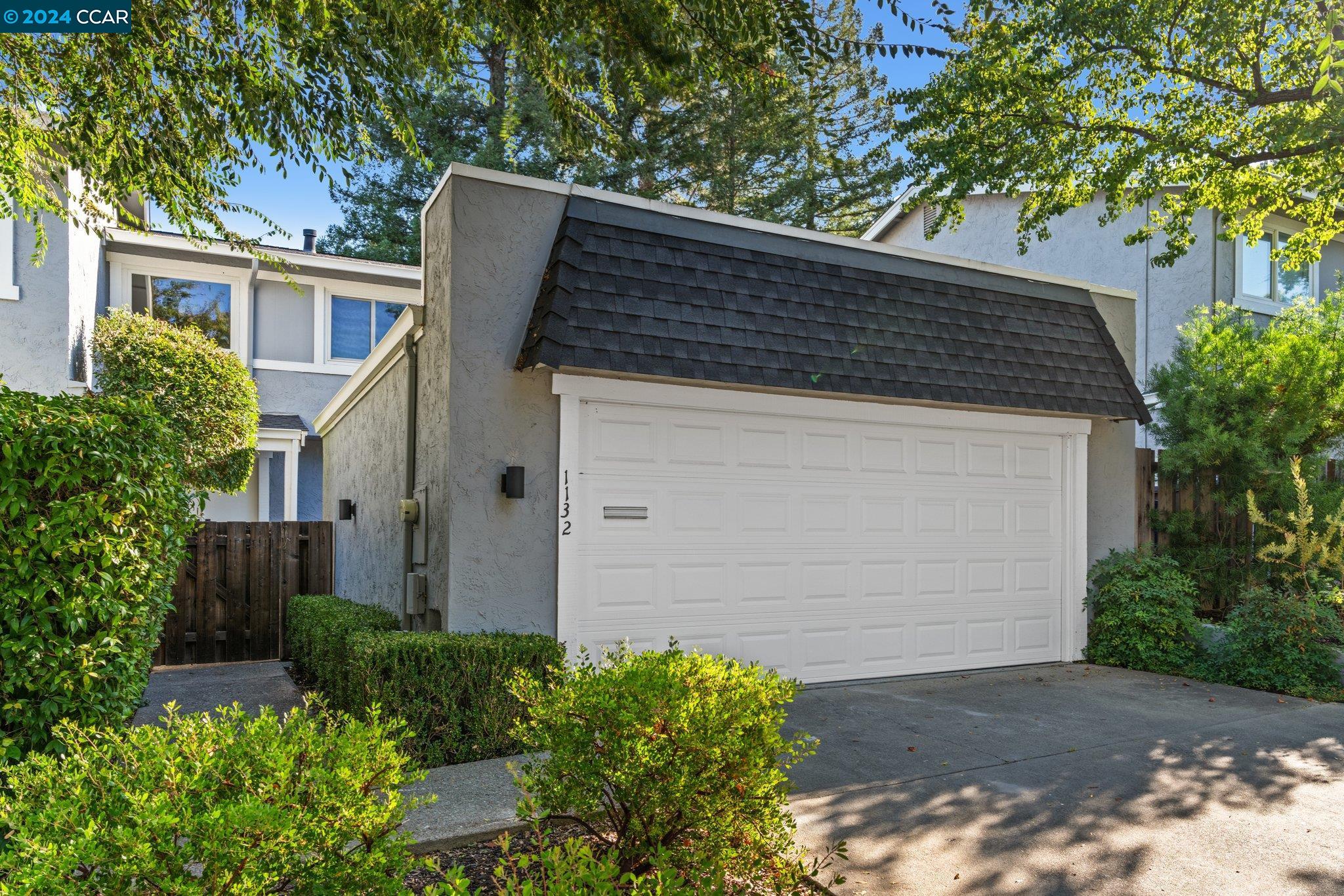 Prepare to fall in love! An inviting front deck w/ room for ample seating greets you on your way in. The heart of the home is the spacious living room, highlighted by a wood-burning fireplace. Sliding glass doors lead you to the backyard where a patio awaits under the shade of mature trees. Connected to the living room is the formal dining room, perfect for festive dinner parties. The refreshed kitchen boasts stainless steel appliances, sleek stone countertops, a 4-burner gas cooktop, a deep farmhouse sink & plenty of storage. The breakfast nook invites casual dining & flows to the bright family room with slider to the front deck. Upstairs, the generous primary suite offers a balcony for relaxation, a spacious closet area & an updated ensuite for your comfort. 2 additional bedrooms share a beautifully designed hall bath featuring dual sinks & a tub-shower combo. Convenience is key w/ a dedicated laundry room that provides outdoor access & cabinetry for optimal organization. The main floor also includes a half bath, a well-appointed wet bar & a detached 2-car garage. HOA includes pool access. Close to tennis/pickleball courts, Rudgear Park, downtown, freeways, BART & top-rated schools.