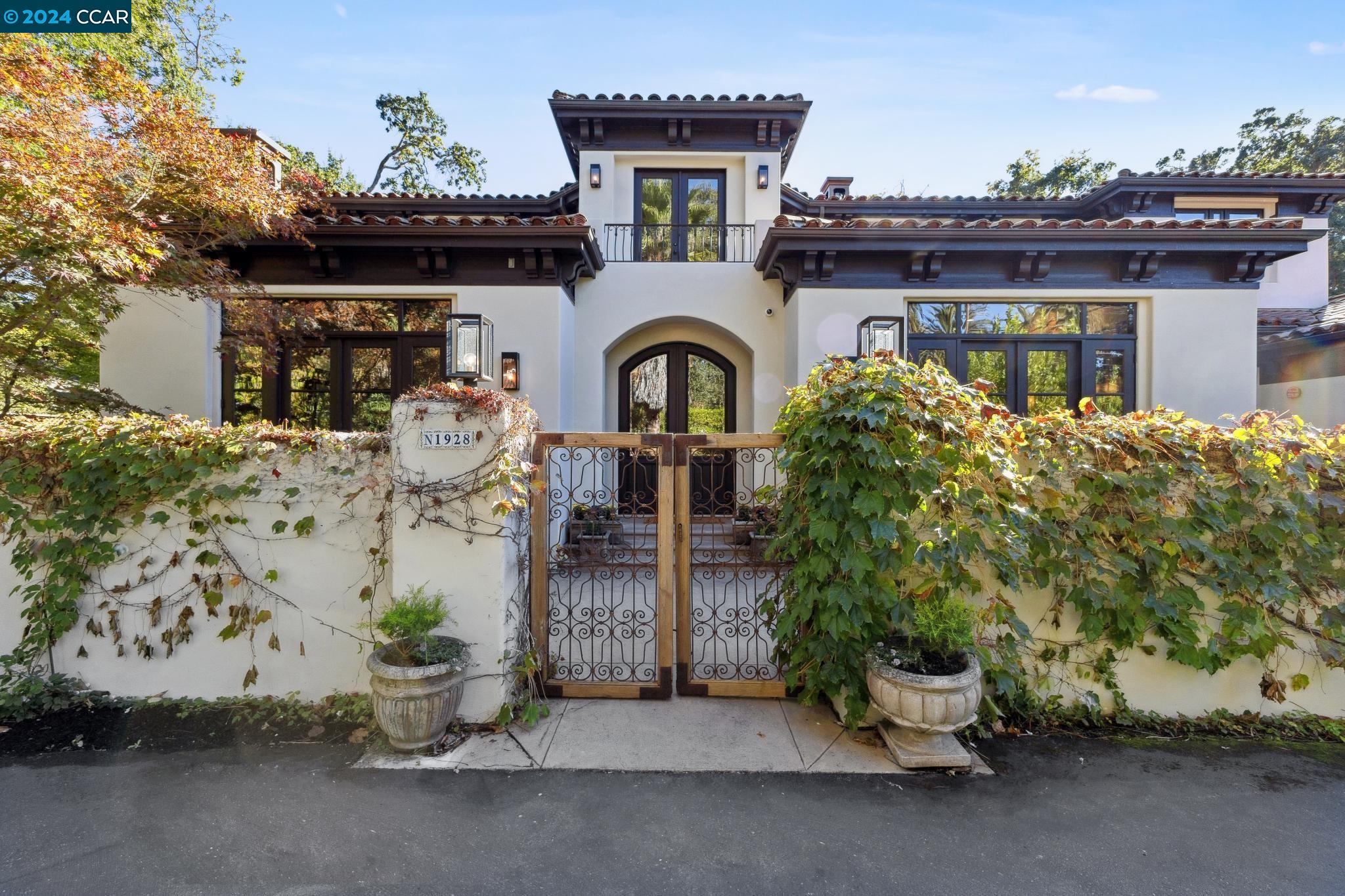 HAVEN Nestled on nearly an acre, along a meandering creek, lies this stunning Santa Barbara inspired home.  Boasting approx. 7183 square feet of gracious living space, this home includes 5 bedrooms, 5.5 bathrooms, including a newly updated kitchen with Mugnaini pizza oven, wine room, stunning office, state of the art gym, play room, media room and a luxurious primary retreat. The outdoor kitchen and convenient dining area is perfect for hosting events.  A large pool and spa grace the backyard.  Cross the creek to an expansive lawn area, great for play and sports.  Or meditate in the zen courtyard. Designed and built to maximize indoor comforts and outdoor entertaining spaces.  Located just a short walk to Diablo Country Club, this home really does have it all. Truly a HAVEN.  Start living the Diablo lifestyle.