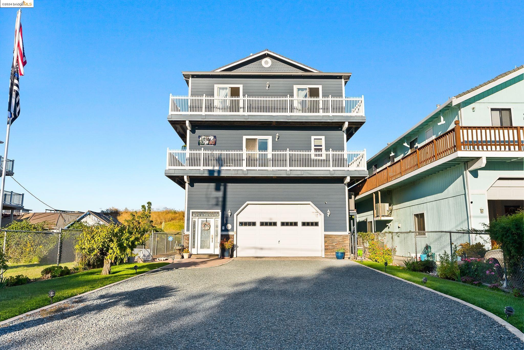 Welcome Home to Paradise! 3,200 sqft., 4-Bedrooms, 4- Bathroom custom home with wrap around decks on both floors with bay views that extend for miles! Open spacious Family room Kitchen combo with lots of natural light. Kitchen has all granite counter tops with custom cabinets, under counter lighting. Walk in pantry. Kitchen Aid Stainless appliances, newer double oven.Instant hot water faucet, industrial ice maker. Tile plank floors throughout second floor. Huge Primary Suite Bedroom overlookingFabulous bay views. Relax in your primary bath Jucuzzi jetted tub. Two other bedrooms are great size.The 4th bedroom has its own entrance with its own small living area and full Bath(possible rental income producer).Exterior of has recently been painted. Three car garage comes with industrial shelving ,your own car lift. Driveway can fit up to 8 cars. Large dock and can accommodate 38ft boat, has newer Industrial gangway, 30-amp power, fresh running water, Irrigation pump for lawn sprinklers. Just imagine relaxing on your back deck BBQ ,listing to music on your Bose surround sound speakers over looking the water and making beautiful family memories.3 minutes to fast water! Desirable Eastern exposure, means your back deck will be shaded in the hot afternoon. No HOA! Open House Oct. 5th 12-3