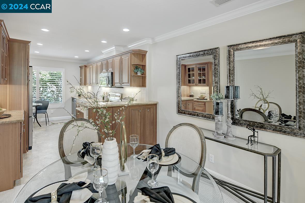 Introducing the beautifully remodeled Mariposa Model, designed to elevate your living experience! Step into elegance with stunning stone countertops, gorgeous cabinetry, eat in kitchen, and modern LED lighting that creates a warm, dimmer switches provide that ambience you desire. Enjoy the convenience of a dedicated laundry room and unwind in the luxurious primary suite. Outside, a spacious deck offers pleasant views, perfect for relaxation or entertaining. Additional features include plantation shutters for style and privacy, plus brand-new carpet and fresh paint throughout. This home also boasts two treasured covered carports, one of which includes extra storage cabinet for added convenience. At the end of a quiet court, this unit offers both privacy and tranquility. Move-in ready and waiting for you this condo with great walkability is nestled in its own valley the vibrant 55+ community of Rossmoor, you'll have access to a wealth of amenities: several clubhouses, golf, tennis, swimming, pickleball, bocce ball, and more. Plus, enjoy the convenience of a fitness center, movie theater, bus service, game rooms for Bridge, Mahjong, Canasta, and a library with over 200 clubs and organizations. This is your chance to embrace an enriched lifestyle.