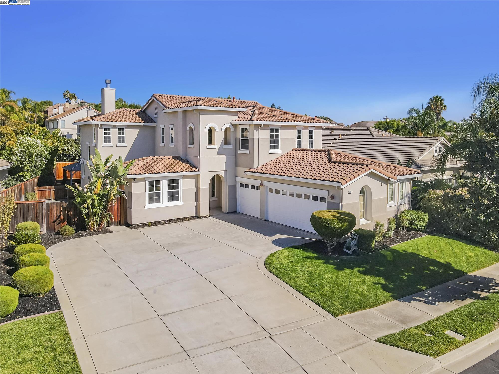 Welcome to Shadow Lakes! your dream home in one of Brentwood's premier neighborhoods, perfectly zoned for top-rated schools. This exquisite property features a spacious three-car garage with an extended driveway, offering ample room for RV or boat parking. Step inside and be captivated by the soaring vaulted ceilings, elegant crown molding. The inviting formal dining room is illuminated by stylish recessed lighting, setting the perfect ambiance for memorable dinners. The heart of the home is the stunning kitchen, which seamlessly flows into the expansive family room. Here, you'll enjoy a tiled stone countertop, a cozy breakfast nook, and a large picture window that bathes the space in natural light. The family room is perfect for relaxing and entertaining. The main level includes a guest bedroom and a full bath. Upstairs, discover a convenient built-in desk area, three additional spacious bedrooms, a full bathroom, and a laundry room. The master suite is a true sanctuary, featuring coffered ceilings, a luxurious in-suite bathroom with dual sinks, a stall shower, a sunken tub, and a generous walk-in closet. The backyard is designed for low-maintenance living, offering the perfect balance of beauty and convenience.  Don't miss the chance to make it yours!