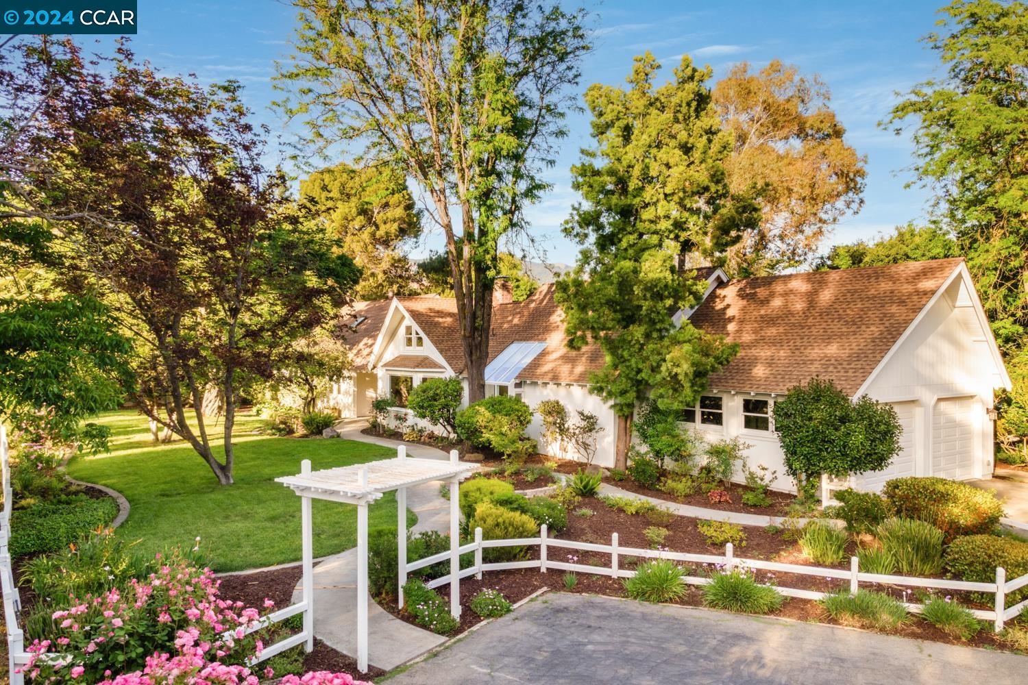This one of a kind property is a perfect place to escape the busyness of everyday life & enjoy the peaceful & tranquil surroundings. Situated on 2.6 flat acres with endless possibilities. This exquisite single level home showcases exceptional craftsmanship, with extensive millwork, vaulted shiplap ceilings, hardwood flooring, & abundant natural light. Custom light fixtures enhance the inviting ambiance.The open floor plan ensures effortless living, with all bedrooms on the left wing for privacy. The right wing houses living areas, including a versatile 315 sqft loft perfect for relaxation. The chef’s kitchen features a center island w/ bar seating, quartz counters, ample cabinetry, Thermador stainless steel appliances & a prep kitchen with wine fridge. The primary suite includes wainscoting, a fireplace, & outdoor access. The spa-like bath offers marble tiling, a walk-in shower, soaking tub, dual vanities, & large walk-in closet. This wing has 3 secondary bedrooms, 2 full baths, & laundry room. Outside, enjoy expansive grounds w/ hillside views, lush lawn, gazebo, deck, & pool. The property offers potential for adding a barn, ADU, or sports court. Located near Danville, Blackhawk Plaza, award-winning school district, this home combines luxury, convenience & expansion potential.