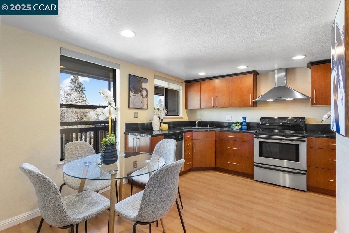 ONE level condo - spacious 1548 square feet,  just blocks from downtown Walnut Creek, Broadway Plaza, & vibrant downtown. One of the best locations in the complex, with a top corner location. No neighbors above or to one side. Open & bright family room w/ vaulted ceilings & fireplace. Two balconies facing downtown with open views. Cozy kitchen nook w/ glimpses of Mt Diablo, and separate formal dining area.  Nearby convenient elevator to secure first level garage, with 2 premium parking spots right by the elevator. Oversized primary bedroom has room for a king bed, desk, & a seating area. Updated kitchen, cabinets, appliances, & walk in pantry.  Updated bathrooms- one with large tub, the other with walk in shower. Inside laundry Closet w/ washer & dryer. One block from Safeway - 2 Blocks from Broadway Plaza. Close to parks, Iron Horse Trail, Whole Foods, Restaurants & public transportation.  Gated community, gated garage. Pool, and courtyard area.  Beautiful sunsets. Value abounds in this move in ready home - make it yours today!