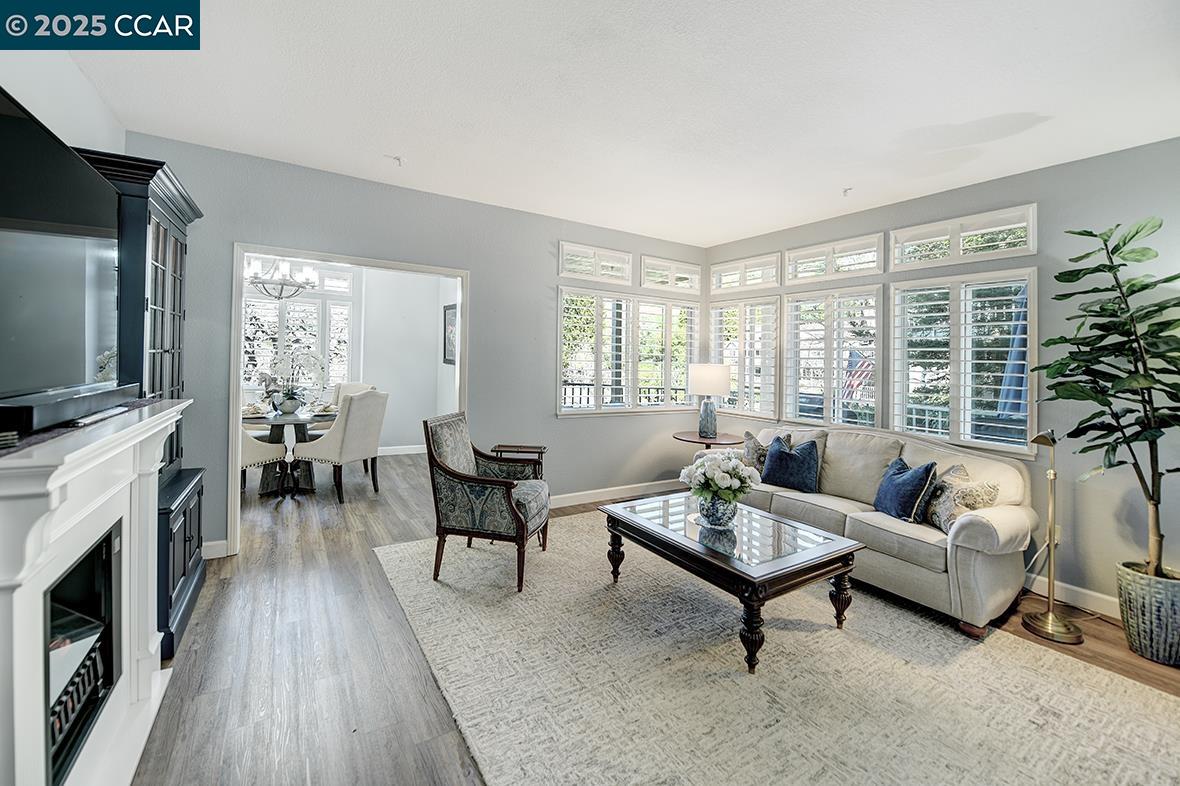 Step into stately elegance with this beautifully upgraded home featuring a stunning living room and luxurious primary ensuite with pitched ceiling. The living room with high ceilings has been thoughtfully re-designed with plantation shutters, crown molding, and removing the original fireplace, creating a seamless flow that invites relaxation and entertaining. Imagine sipping coffee on the expansive deck, with serene seasonal views of the vegetation and golf course. Golf Cart also available for sale. The home is painted in a soothing blue-grey palette, offering a calm inviting atmosphere. Garage boasts is in the building next to the unit with back door access close to front entrance of condo and has an extra storage loft perfect for maximizing space. Enjoy this and Rossmoor, a lively community where you’ll find an array of activities and amenities to suit every interest—from golf and tennis to pickleball and bocce ball, and from bridge and Mah Jong to art and ceramics… Embrace this moment and make this welcoming community your new home.