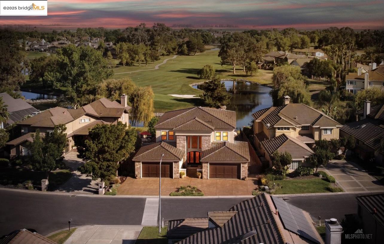 Unquestionably one of the best homes in all of California. On one of  the finest Golf courses  of Discovery Bay, fine living which is situated behind private gates with views beyond. This trophy estate is one of the most distinguishable homes in the entire zip code and is positioned to enjoy 220 degree unobstructed views of the rolling greens, sparkling waters, golf course greens, and the glistening club house that spans views of the Livermore hills. Designed by local architect and Constructed in 2009, no expense was spared with exquisite details such as imported floors, slab counter-tops, smooth plaster walls, and handcrafted fixtures throughout to name just a few. The thoughtful floor-plan offers ample formal spaces, Open concept living, chefs kitchen. with a 4 car garage. The property is a true treasure and can be shared with generations to come. Steal Framing and slab flooring designed forever home.