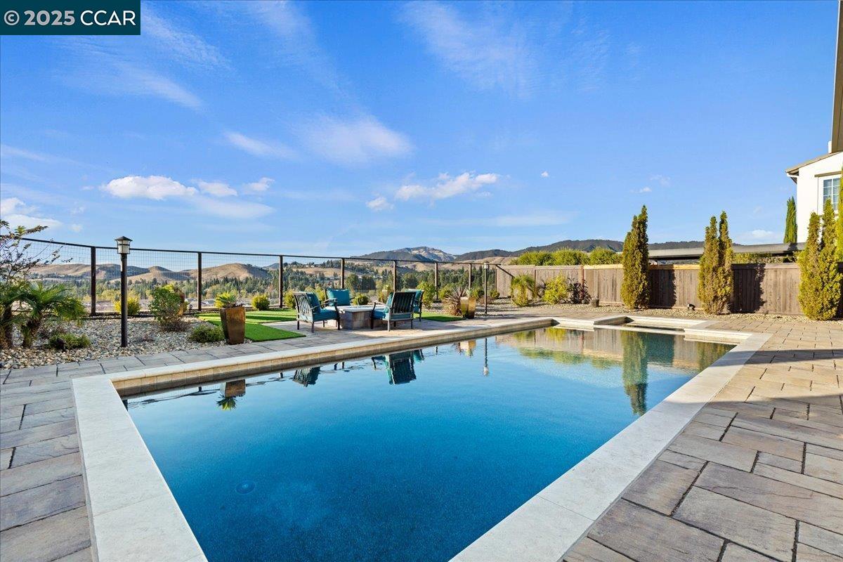 Unbelievable Mt. Diablo Views. A Shapell Tuscany masterpiece, located in the most prestigious part of Alamo Creek. Executive home in the coveted Alamo Creek neighborhood. It is graced with new luxury hardwood floors, quartz countertops, recessed lighting, and designer amenities throughout. The modern, open floor plan features a spacious dining room overlooking private courtyard as well as a family room with fireplace and a dramatic two-story foyer curved staircase. The gourmet quartz & stainless steel kitchen will delight any chef featuring a waterfall island and a spacious butler’s pantry. Unobstructed views of the city and hills from each window is a bonus! This House, like NO OTHER offers 4 bedrooms each with its own full bathroom and a walk-in custom-made closet. Loft and retreat can be easily converted to a 5th and 6th bedroom. Dual HVAC zones. Whole House Fan. Surround sound systems and multimedia wired throughout. Main floor offers sanctuary like laundry room with daylight windows, utility tub and cabinetry. The 2 car garage provides custom made closets and overhead storage. Located on a premium private cul- de-sac lot, this home features a private yard with a resort-style oversized swimming pool, Spa, built-in BBQ island and a firepit.