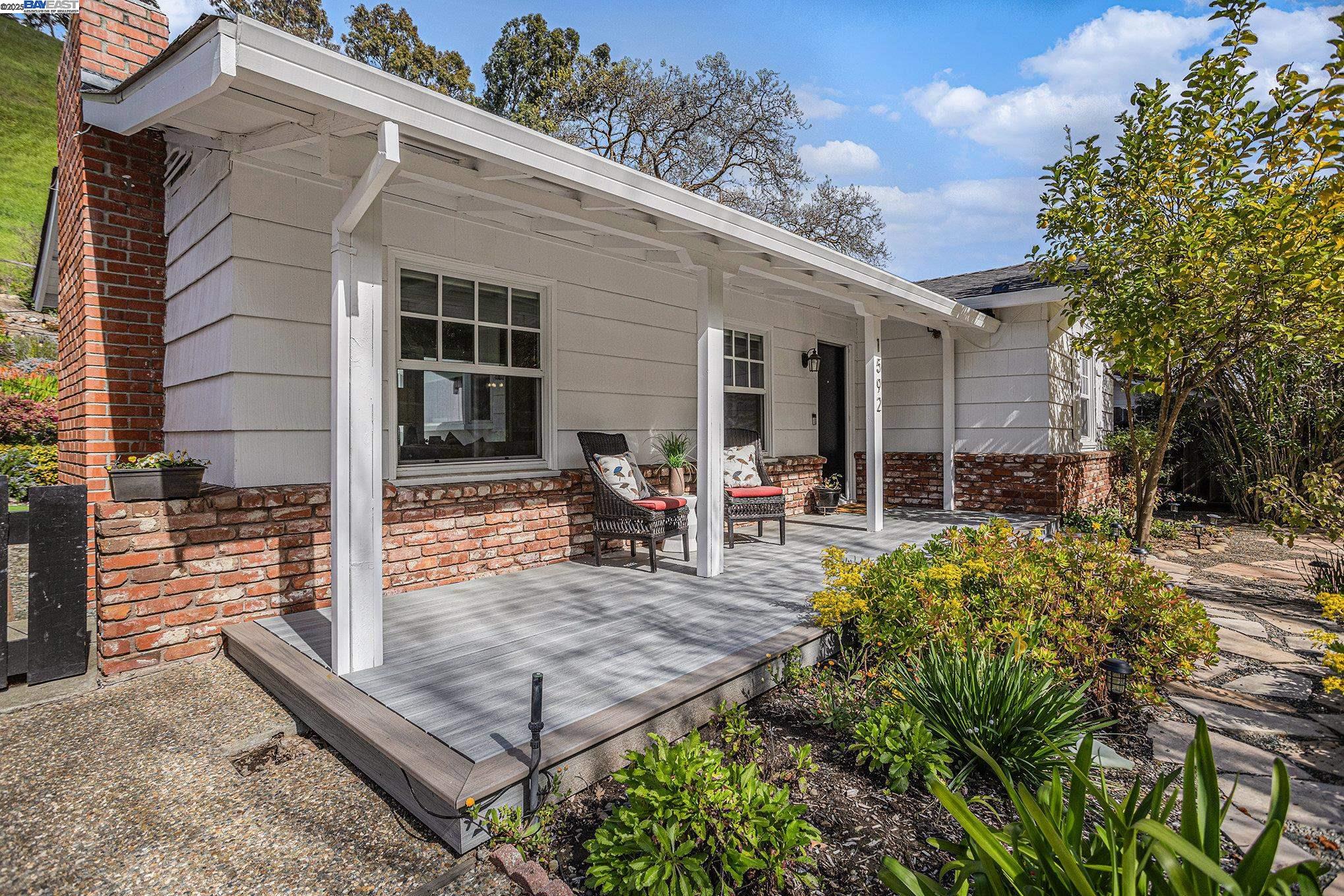 Lafayette boarder, Lafayette schools!! - Oozing with appeal! Charming ranch style home on .37 parcel just minutes from downtown Lafayette/WC. Set way back off the street with an extra long driveway to a carriage garage. The main house is west facing with an abundance of natural light filling the open concept floor plan. Enjoy a generous primary suite with newly remodeled and expanded walk-in dressing room and luxurious bath, newer roof, updated flooring, designer touches in the spacious kitchen, newer dual pane windows and walls of glass to help bring the outdoor beauty in! Professionally landscaped yard from the curb to the far rear fence, backing to open space. A spectacle of hundreds of drought resistant flowering plants firing off 12 months a year & a backdrop of sweeping hills of green, majestic oaks and wildflowers adding to the appeal of this serene setting. Plenty of areas to entertain inside and out.  Crushed stone walkways, bocce court, artificial turf, string lights, all weather decking, retaining wall improvement and so much more! A commuters dream location w/ EZ access to HWY 24, 680, BART and the magic of downtown WC and Lafayette.