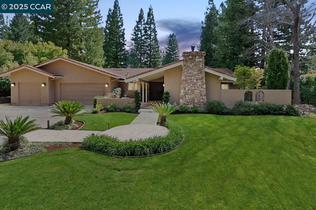Find the treasure in Danville’s gated Hidden Oaks. Meticulously maintained & brilliantly updated single-level sensation. 3643+/-SF. 5 bds. 3.5 bths. .43 acres. Bkyd sanctuary. Pool, spa, gas fire pit, deck, patio, pergola, spts ct. Bordering redwds, rose garden, lush foliage, lawn. Room for ADU ideal for in laws, guests, income-producing rental. Hardwd & carpet. Skylights. Crown molding. Recessed lights. Dual-pane Andersen drs & wndws. Formal living rm w/vaulted exposed beam ceiling, frpl, built-ins. Formal dining rm. Chef’s kitchen w/leathered quartzite counters, travertine tile bksplsh, custom cabinets. GE Monogram appls: Dual ovens, five-burner cooktop, refrigerator, microwave. KitchenAid dishwasher. Casual dining area. Fam rm w/frpl. Bonus rm w/custom built-ins, rm for pool table, home theater & more. Slider to bkyd. Primary suite w/gas frpl, sitting rm, vaulted ceiling, slider to bkyd. Updated en suite w/2 vanities, walk-in closet, stall shwr, new fixtures. Add’l bdrms w/carpet, California Closets built-ins. 5th bdrm/office w/2 built-in wrkstations. 3-car garage. 3 EV outlets. Storage. Updated dual-zoned HVAC, wtr htr & pool equipmt. Laundry rm, flr-to-ceiling cabinets, sink. Near Blackhawk Plaza, downtown, walking trails, Mt. Diablo, freeways. 3 mi to top-rated SRVUSD schls