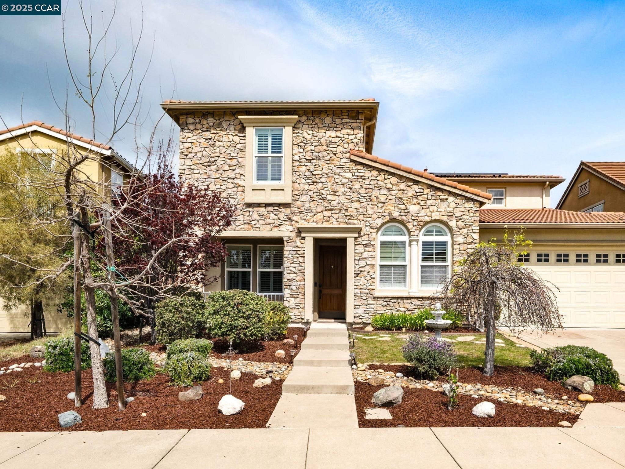 Welcome to 2006 Colmar Street, a stunning Mediterranean-style home located in Danville’s highly desirable Monterosso community. This spacious two-story residence offers 5 bedrooms, 3 bathrooms, and two bonus rooms. The home features elegant hardwood floors, a dual fireplace, and open-concept living areas that are perfect for both everyday living and entertaining. The gourmet kitchen is a chef’s dream, complete with high-end appliances, granite slab countertops, and custom cabinetry. The luxurious primary suite boasts a sunken tub and a separate stall shower, while all bathrooms have been tastefully updated with modern finishes. Nestled on a 6,303 square foot lot, the backyard is a private oasis with a sparkling swimming pool—ideal for relaxing or hosting gatherings. Additional highlights include a 3-car attached garage, dual-zone central A/C, and a tankless water heater. Conveniently located within walking distance to highly rated schools and surrounded by greenbelt areas and a neighborhood playground, this home is perfect for families. Built in 2007 and meticulously maintained, this property offers the perfect blend of comfort, style, and prime location—don’t miss your chance to make it yours!