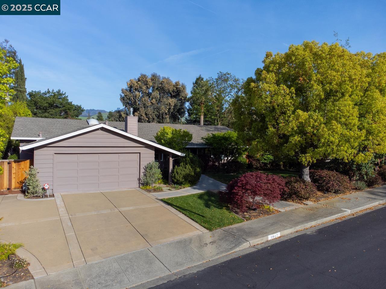 Welcome to this spacious single-story home ready for your personal touches! The charming residence features retro-style carpets, classic wood-paneled walls, evoking a throwback feel. The open formal living room/dining room features a gas-burning fireplace, picture windows with bench seating, built-in cabinetry, and a sliding glass door to the back deck. The eat-in kitchen includes stainless steel appliances, breakfast bar, and an easy flow to both the entertaining family room and den with custom shelving and a wood-burning fireplace. The primary suite boasts a vaulted wood-beam ceiling, window bench seating, cozy fireplace, walk-in closet, private sliding glass door to the back deck and a spa-like bathroom with dual vanities, soaking tub, and stall shower. Other features include a lush, .31 acre level park-like yard perfect for outdoor living and entertaining, complete with a sparkling pool and a sports court, oversized two car garage, abundant storage, Generac home generator, and views of Mt Diablo, minutes to Heather Farm park, shops, restaurants, trails, open space, and all twelve-years of school. Whether you're looking to modernize or simply enjoy the unique character of this home, it presents an incredible opportunity to create your own dream space.