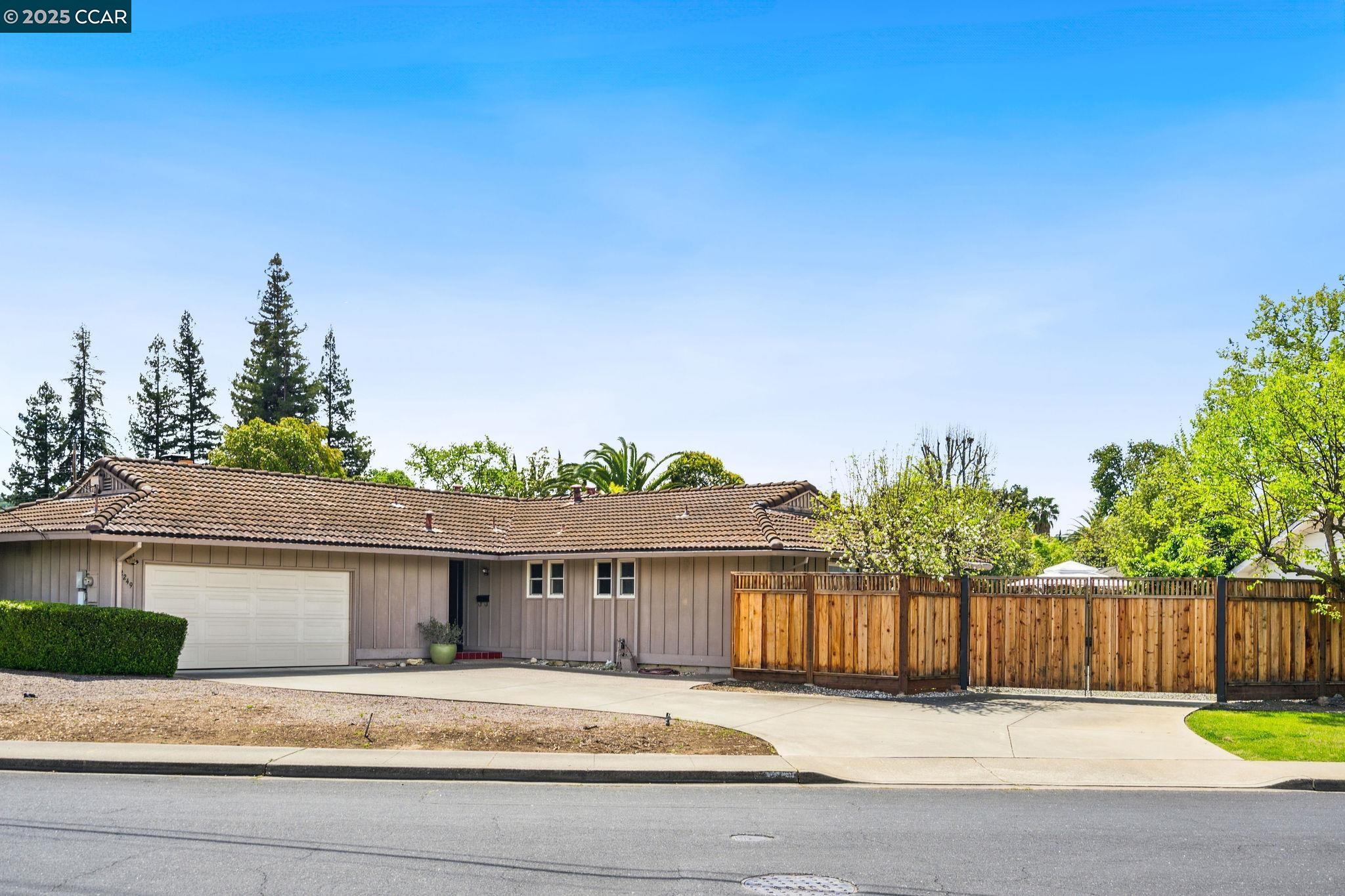 Situated in the desirable Northgate neighborhood on a flat lot, this single-story home features 2 bedrooms with room to create a third bedroom & 2 bathrooms. Ready to put your own touch on it, this charming home offers parquet & hardwood flooring & neutral paint throughout. Illuminated by a large skylight, the kitchen is appointed w/a breakfast bar, gas stovetop & nook that seamlessly flows into the family room. The quintessential family room boasts a fireplace, built-in bookcases, vaulted ceilings & a sliding glass door that leads to the backyard patio. Perfect for entertaining, the formal dining room features a two-way fireplace that connects to a grand room w/a wall of sliding glass doors, providing an ideal space for a third bedroom or living room. The primary suite has dual closets, an ensuite bathroom, & direct access to the side yard. Additional highlights include a secondary bedroom, a full hall bathroom & laundry room. Outside, enjoy the privacy of a fully fenced backyard, complete w/a sparkling swimming pool, 2 storage sheds, patio & lush lawn. There is also a 2 car garage & space for RV/boat parking. Conveniently located near Oak Grove Swim Association, Arbolado Park, The Orchards Shopping Center, & top schools like Foothill Middle School & Walnut Acres Elementary.