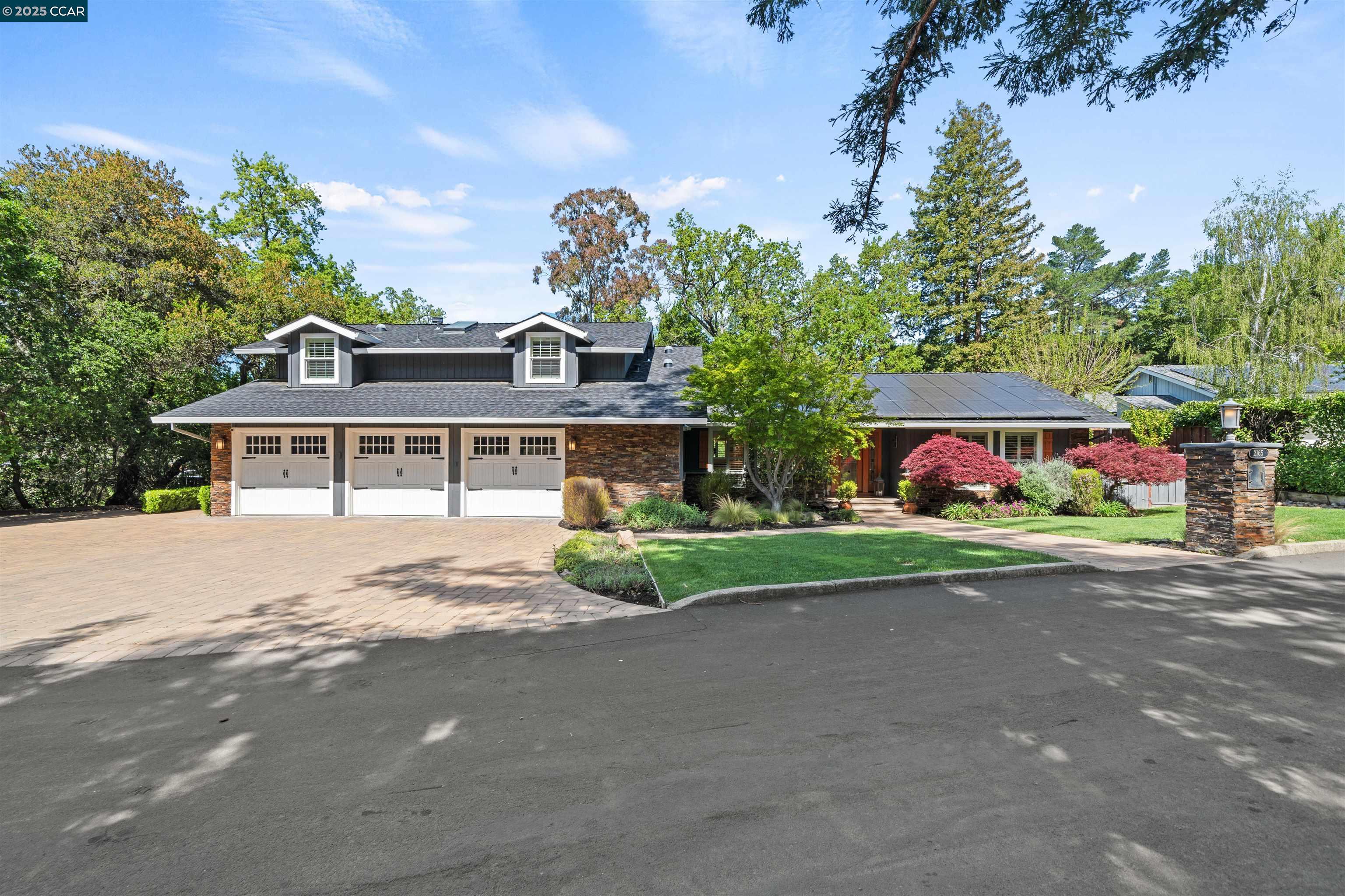 Tucked away in a private, resort-like setting, this single-level home is the ultimate California retreat. The beautifully remodeled interior offers vaulted ceilings, an open-concept floor plan, and abundant natural light through skylights and walls of glass. The heart of the home flows seamlessly into a stunning backyard oasis featuring a pool, spa, cascading water features, fire bowls, and a sunken firepit lounge. An outdoor kitchen with a built-in BBQ and bar seating under a pergola makes entertaining effortless. The fully-owned solar system adds efficiency, while the three-car garage and expansive driveway provide ample parking. Surrounded by mature trees and lush landscaping, this home offers serene privacy just minutes from downtown Danville, top-rated schools, and Mount Diablo hiking trails. A rare opportunity to enjoy luxury living in a peaceful, natural setting. Do Not Miss This One!