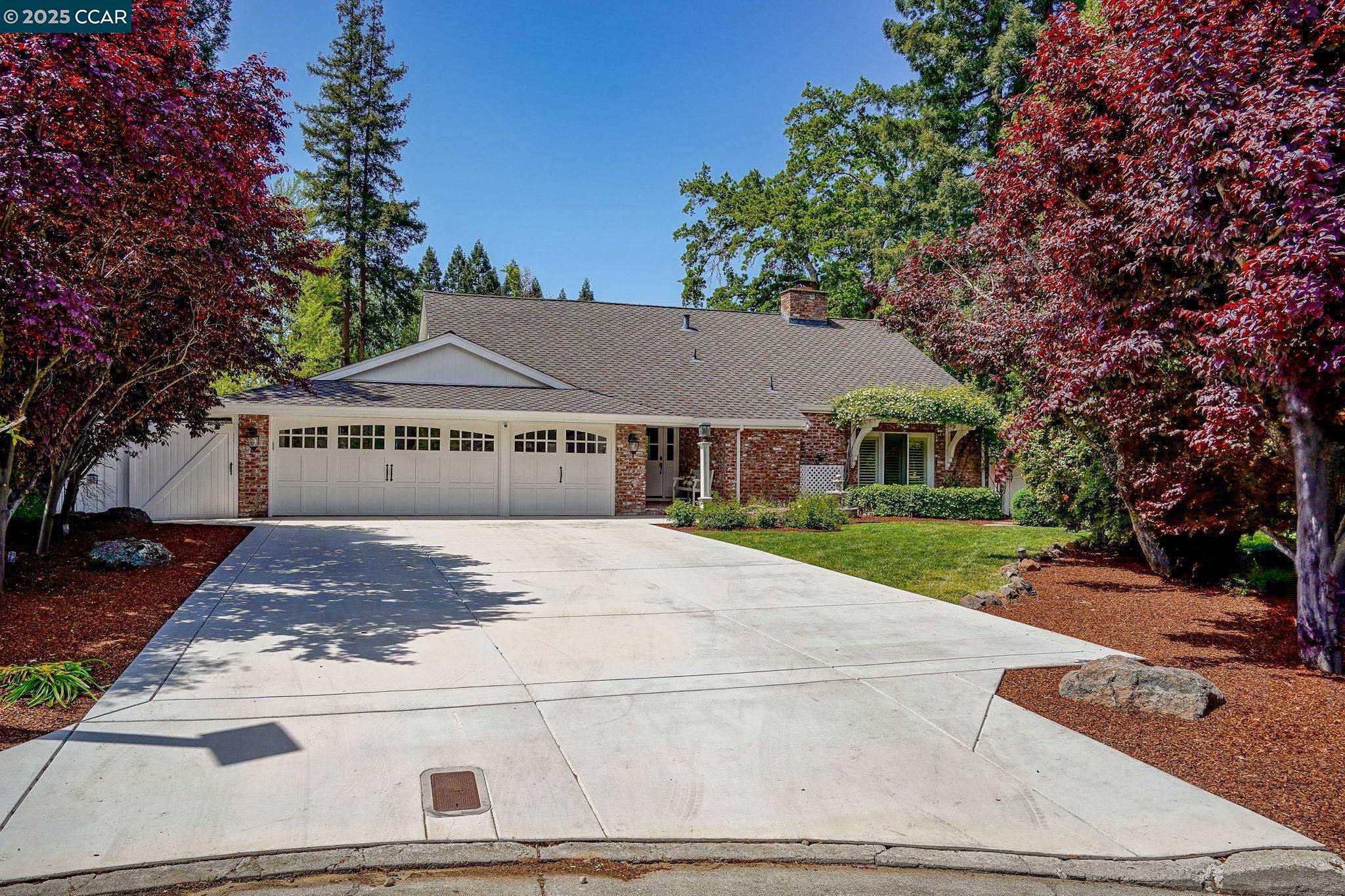 One story, at the end of a quiet court, large private lot with a seasonal creek meandering by. Hardwood floors, many windows and soaring vaulted ceilings in the living room, kitchen & family room & primary bedroom. All 4 bedrooms have French doors. Remodeled kitchen with stone counters, custom cabinets, side by side freezer/refrigerator , island and breakfast bar, dbl ovens, gas range & pot filler, dbl d/w.Wainscoting on hallway walls. Views of the low maintenance yard with 4 patios, 2 large redwoods and 1 beautiful oak tree.Wrought iron fence, small wood deck overlooking the creek. All 3 bathrooms have been remodeled in the past 6 years. Owners have added solar, h/a system & replaced ducting, French drain system & sump pump, new driveway, custom bookcases & cabinets, added ceiling lights in bdrms & family room, whole house water filtration system, security cameras, remote window coverings. Added over 260k in improvements in past 6 years. Garage has finished walls, epoxy floor & custom cabinets.