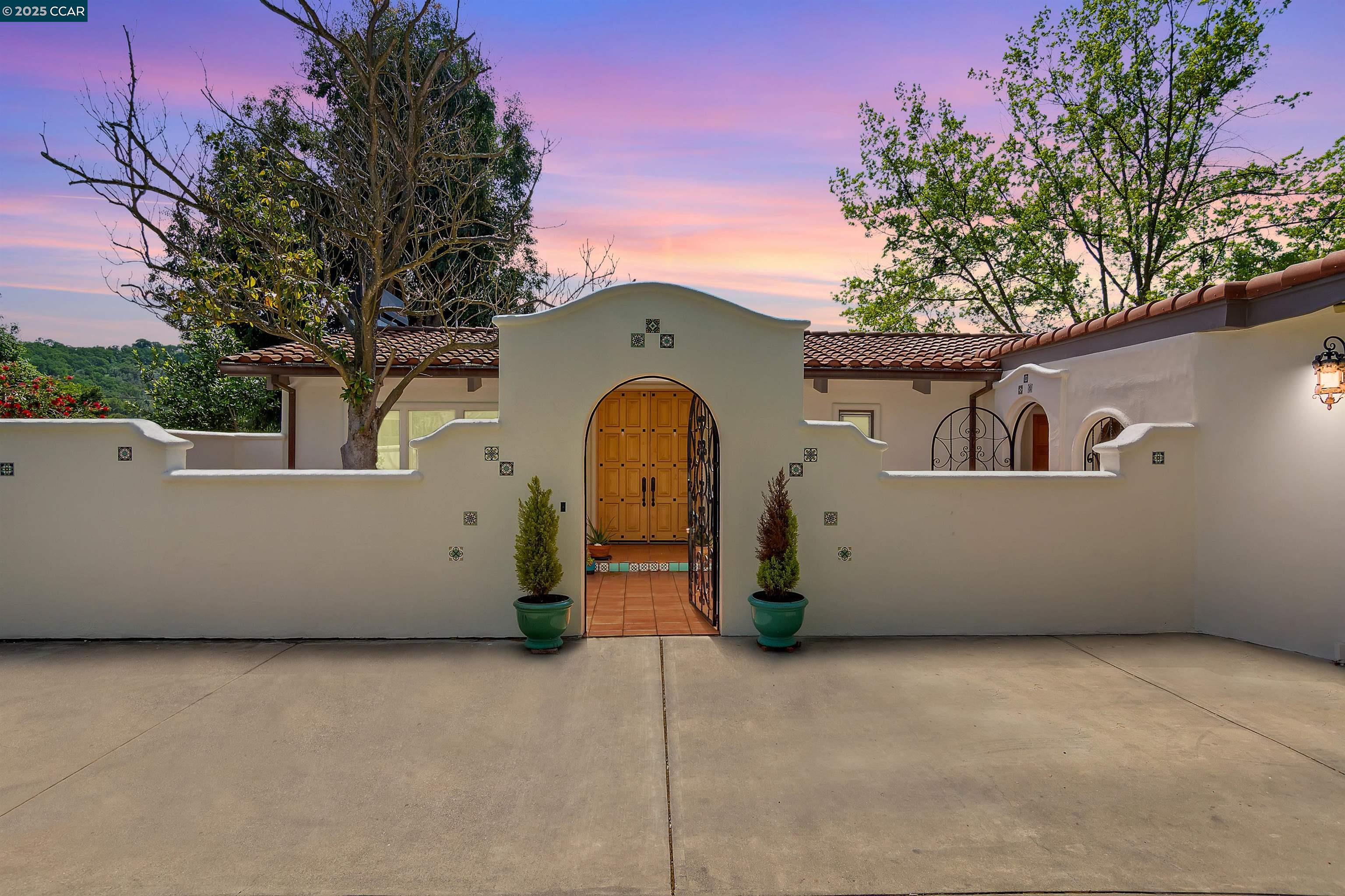 Westside Alamo 2-level home w/$200,000+ in upgrades incldg solar panels, renovated primary suite, bthrms, resurfaced driveway, fresh ext paint & more. Decorative iron-gated courtyd entry. Updated contemporary light-filled 2486+/-SF on .77 acres. Las Trampas Ridgeline & hillside views. Vaulted exposed beam ceilings. White oak hardwd flrs. Large picture wndws. 4 bds. 2.5 updated bths. Formal living rm w/new gas insert frpl. Formal dining rm. Chef’s eat-in kitchen. Custom cabinetry. Quartz counters, peninsula island/bkfst bar, subway tile bksplsh. Stainless Dacor, Fisher & Paykel, LG appls. Family rm w/vaulted ceiling. Covered/open tiled terraces, 2-levels of gardens, lawn, towering shade trees, raised beds, gentle slope. Possible pool & outdr kitchen site. Primary suite w/new walk-in closet & en suite. Curbless shwr, dual-sink floating vanity, free-standing tub, brushed gold fixtures, porcelain tile flr. 3 bdrms share updated bth w/glass-enclosed curbless shwr, floating vanity, LED mirror, porcelain tile walls & flr. Laundry rm upgrades, new cabinets, flr, outdr access. Ecobee thermostats. Digital sprinkler/temp controls. 2-car garage. EV charger. 200+/-SF media/playrm, wet bar. Storage rm or ideal wine cellar, gym, workshop. 2 mi to downtown Walnut Creek, Alamo Plaza. Near freeway