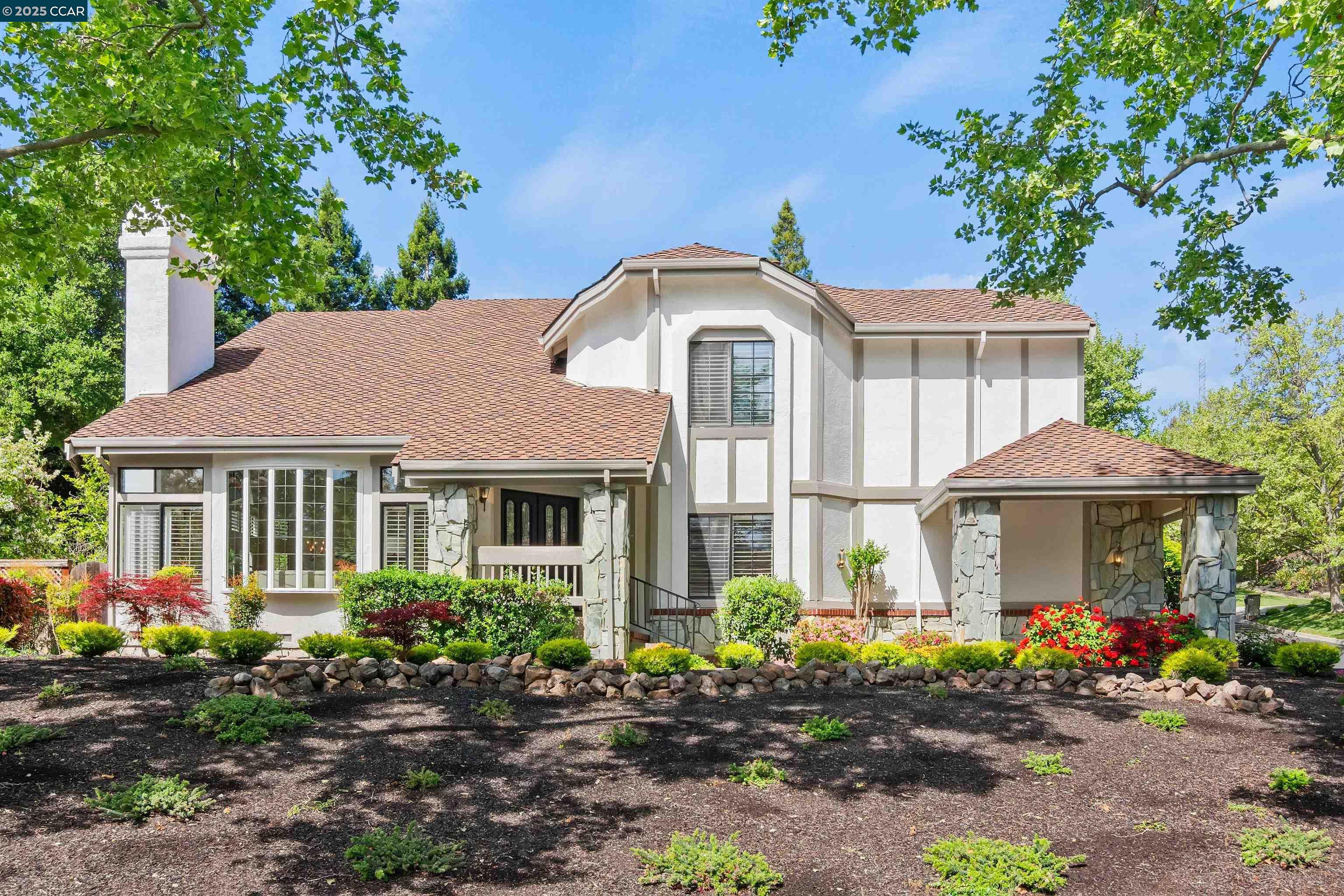 Luxurious, light-filled 2-level north-facing flrplan. Corner lot. Open space views. W/in gates of Blackhawk Country Club. Double dr entry. 2673+/-SF. 4 bds. 3 bths inclds main-level bdrm/office behind glass French doors. Hardwd flrs. New carpet & LVP. Fresh int paint. New lighting, basebrds. Plantation shutters. Soaring vaulted ceilings. Transoms. Updated fixtures. Formal living rm w/gas frpl, front-facing picture window. Formal dining area w/French drs to bkyd patio. Updated chef’s kitchen. Quartz counters, backsplash, white cabinetry. Island/breakfast bar. DCS 5-burner cooktop, Bosch dishwasher, LG refrigerator, oven, microwave. Backyd/hillside views. Casual dining w/French dr to bkyd. Adjacent fam rm w/frpl, wet bar w/quartz counter, upper glass-faced cabinets, wine storage. Primary suite, double-door entry, vaulted ceiling, large closet, sliding mirrored drs. En suite w/dual-sink vanity, jetted tub, shwr, updated fixtures. 3-car garage. Laundry rm w/sink, cabinets. Ring doorbell. Dual HVAC. Drought-tolerant frnt landscaping. Updated fencing. Bckyrd patio, lawn, fruit trees, gentle slope ideal for terraced gardens. Near clubhouses, golf courses, tennis/pickleball cts, fitness ctr, sports complex, pool. Near downtown, walking trails, Mt. Diablo, top-rated SRVUSD schls.