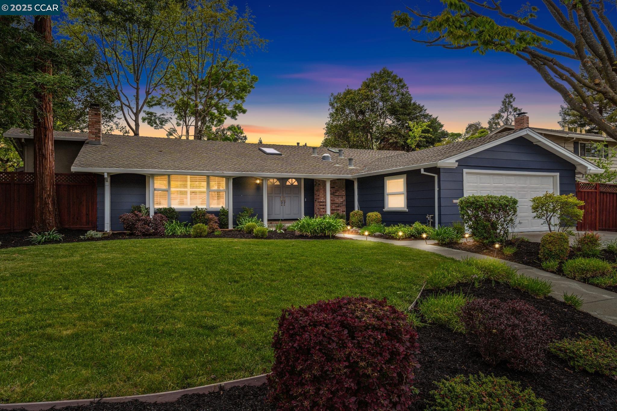 New Northgate Listing! Welcome to this beautifully updated single-story home nestled on a picturesque, tree-lined street with convenient access to local trails. This charming residence features gleaming hardwood floors, an open-concept layout, and skylights that flood the space with natural light. Enjoy entertaining in the spacious formal dining room and elegant living room with a cozy fireplace. The remodeled gourmet kitchen boasts a large island and eat-in area, opening seamlessly to the inviting family room with its own fireplace and French doors leading to the serene backyard.  The expansive primary suite offers two walk-in closets and a luxurious, remodeled bathroom with heated floors. Two additional bedrooms share a stylishly updated bathroom. You'll also love the large laundry room and the peaceful backyard retreat, complete with patios, a pergola, level lawn, pathways, and a generous side yard.  Located in the highly desirable Northgate neighborhood with top-rated schools, this home is just steps from scenic trails and minutes from Whole Foods and the Orchards shopping centers.