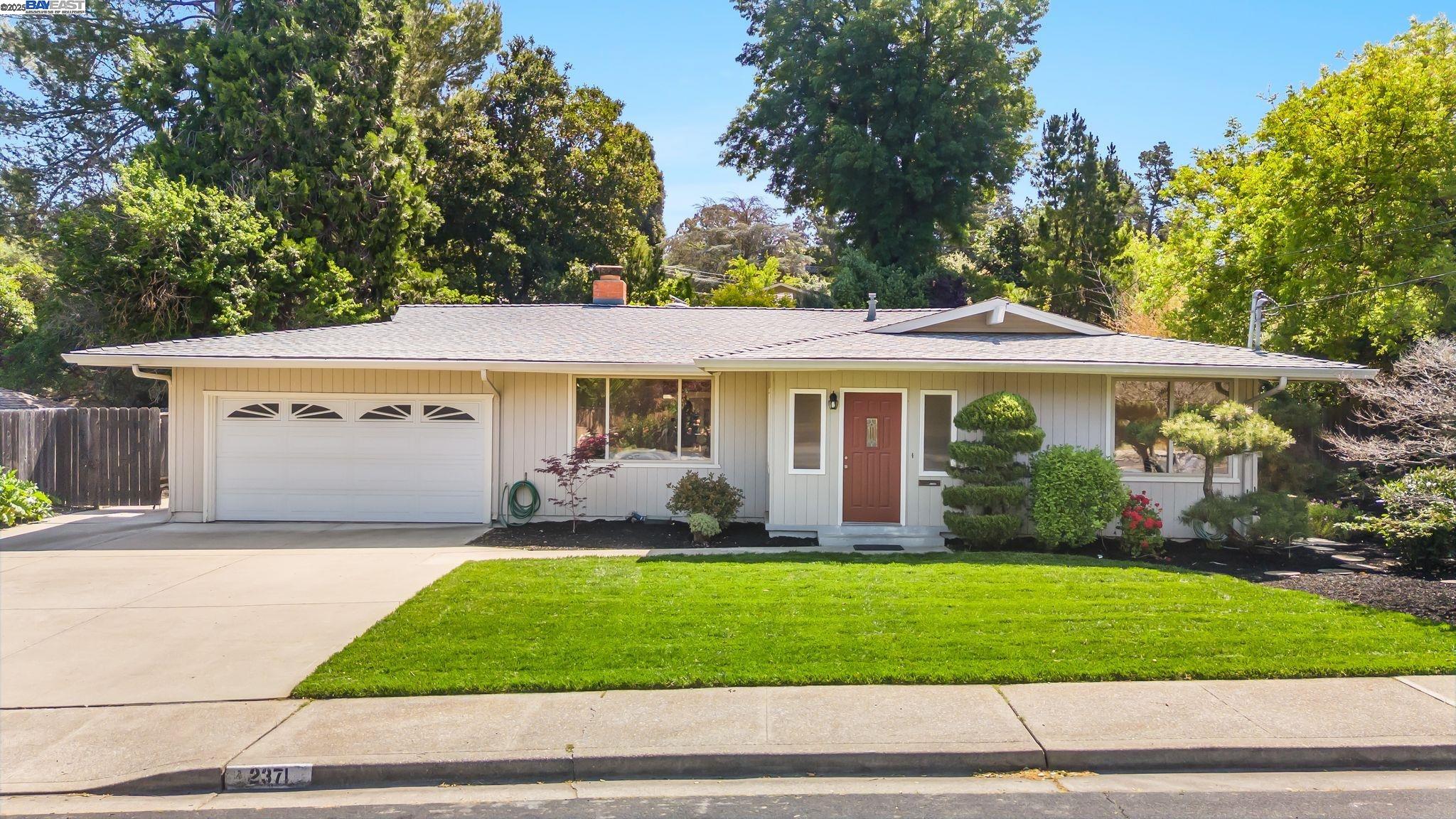 Welcome to 2371 Mallard Drive, a beautifully updated single-level home nestled on the border of Walnut Creek and Pleasant Hill. This 3-bedroom, 2-bathroom home offers 1,313 square feet of comfortable, modern living on an expansive 11,700 square foot lot—perfect for those who value space, style, and location. Step inside to discover a bright, open layout with updated flooring, a refreshed kitchen, and generous living spaces designed for both relaxing and entertaining. The spacious sunroom is a true highlight—flooded with natural light and ideal for a home office, reading nook, or flexible bonus space. Central A/C and heating ensure year-round comfort, while the attached 2-car garage offers convenience and storage. Outside, you’ll find your private backyard retreat—thoughtfully landscaped with mature trees, lush greenery, and plenty of room to garden, entertain, or unwind. Located in a top-rated school district and just minutes from freeway access (24 and 680), BART, shopping, restaurants, and parks, this home offers the perfect blend of suburban tranquility and commuter-friendly convenience. Enjoy everything the East Bay offers with this move-in-ready gem in a peaceful, established neighborhood.