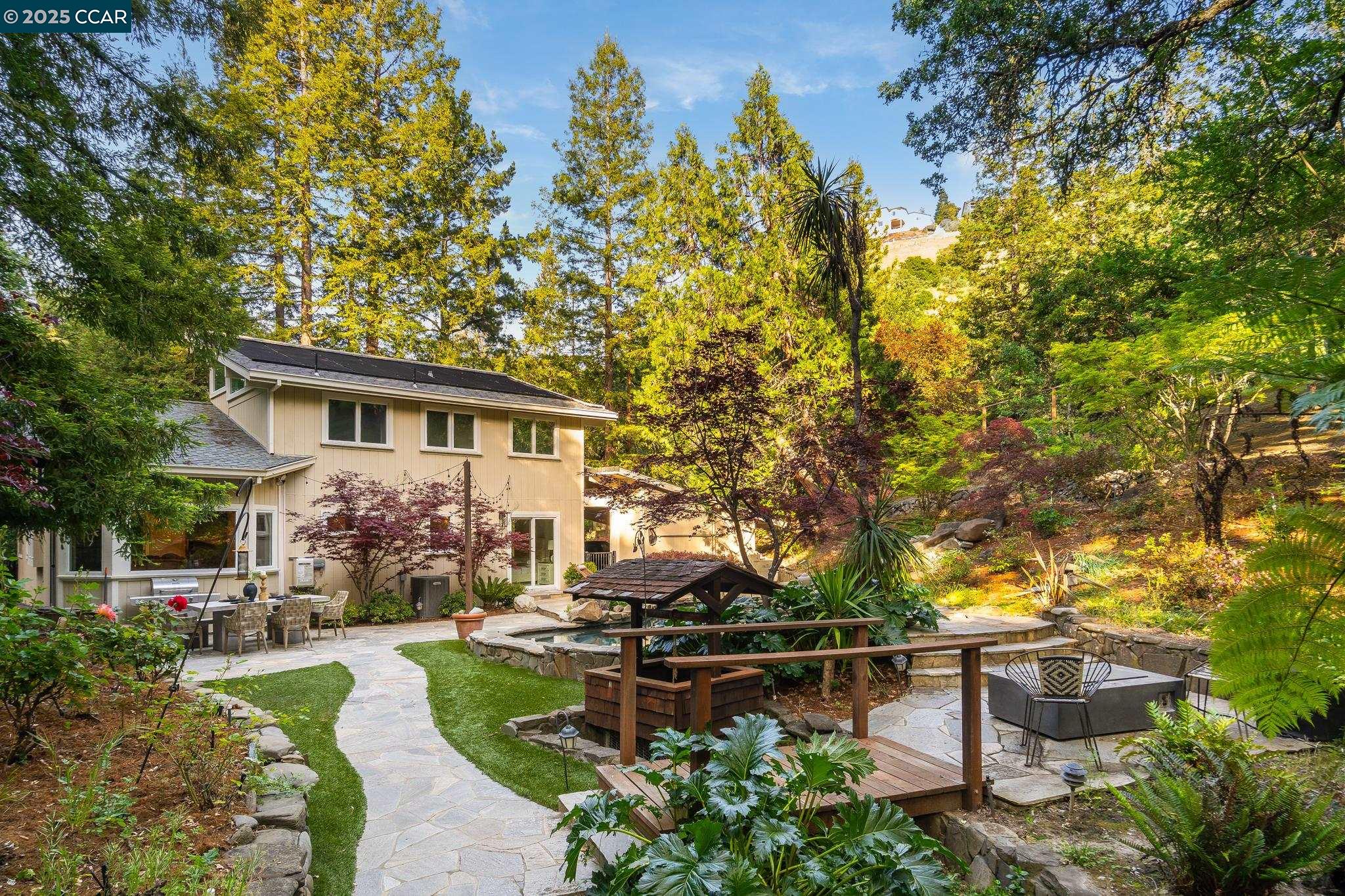 2 houses on 1 lot! Tahoe-style country home on the border of Walnut Creek/Alamo, minutes from downtown. Sprawling 1.24-acre lot surrounded by majestic oak & redwood trees, this private retreat in serene, natural setting. Vaulted ceilings & exposed beams create openness, abundant windows fill the space w/ natural light. Inviting great room features a wood-burning stove. The spacious kitchen boasts a breakfast bar, gas range, ss appliances, custom lighting & a large dining area. On the main level, you’ll find the primary bedroom, office, full bath, & convenient laundry room. Upstairs, a charming loft area, two additional bedrooms & full bath. Outside is a stunning stone-ridge heated pool & natural waterfall. Sitting area offers a peaceful spot to relax, while a finished detached shed w electricity provides a space for workouts, hobbies, or extra storage. This property also includes a fully separate ADUw/ its own entrance & driveway. The ADU features one bedroom, one bath, a full kitchen, laundry room & ample living space—perfect for guests, extended family, or rental income. ($3500 mont rent for ADU) Located just minutes from vibrant downtown Walnut Creek, Downtown Danville, freeways, w/ easy access to parks, shopping, & top-rated schools. This lot can be split.