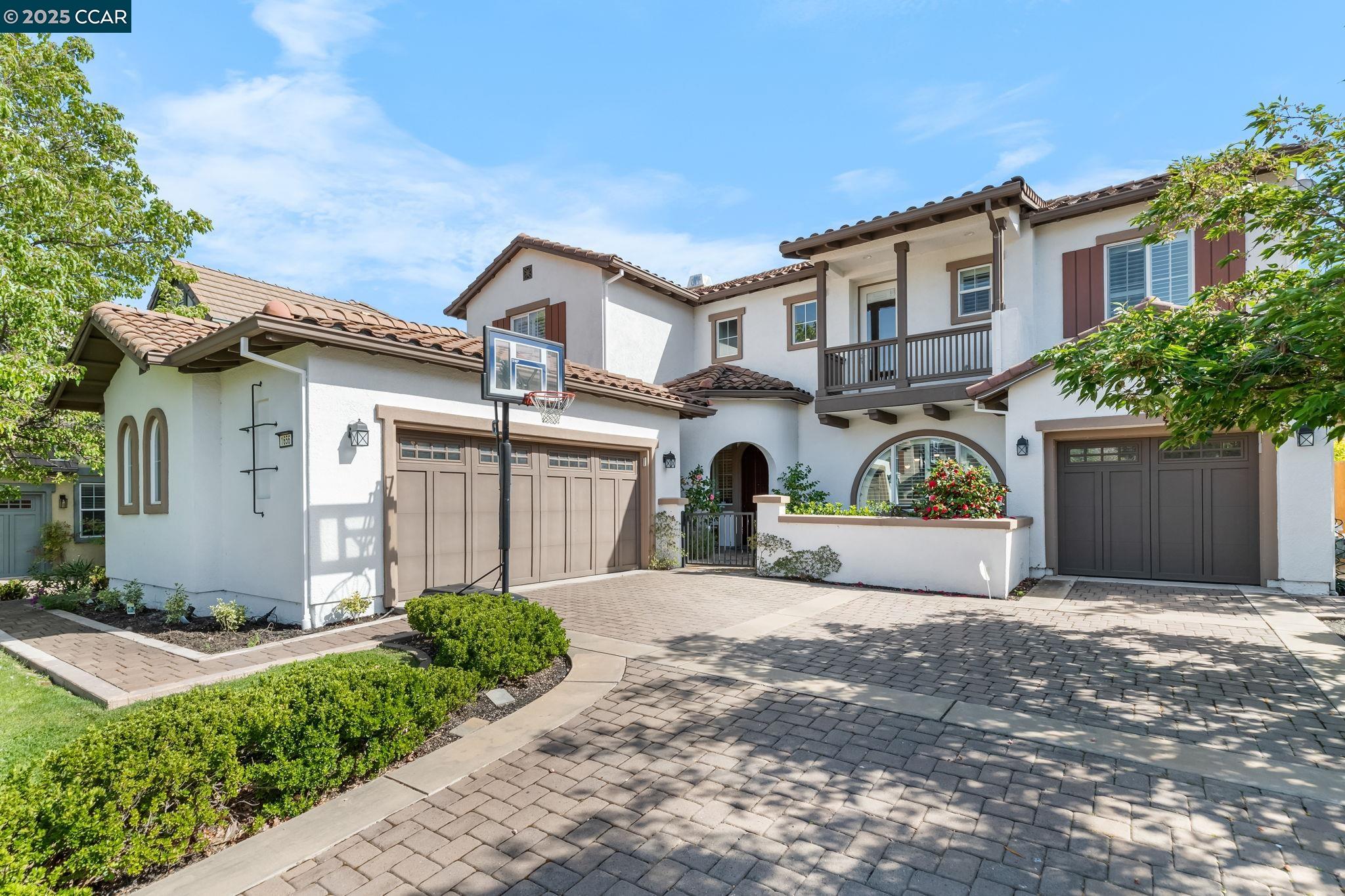 Located in the prestigious Monterosso community, this highly sought-after model, North-facing home offers an impressive 3,252 square feet of living space sitting on 6970 square feet of prime property and an open floor plan. The house features 5 spacious bedrooms, 4 full bathrooms, a loft, with the primary bedroom and attached bathroom featuring a jetted spa tub, his and her sinks as well as walk in closets. A convenient downstairs bedroom/office and full bath is perfect for guests or extended family. The gourmet kitchen boasts granite countertops, a generous center island, a pantry, stainless steel appliances throughout including double ovens, 5 burner gas stove, newer dishwasher and custom-sized refrigerator. Other features include plantation shutters throughout, recessed lighting, hardwood floors, new fixtures, leased solar panels and custom cabinetry to elevate the home’s elegance. The 3-car garage, one equipped with an EV-Charger provides ample parking and storage. The property is near Diablo Vista Middle School, Creekside Elementary, Blackhawk Plaza and Tassajara Crossing. The home offers access to top tier education, shopping and entertainment.