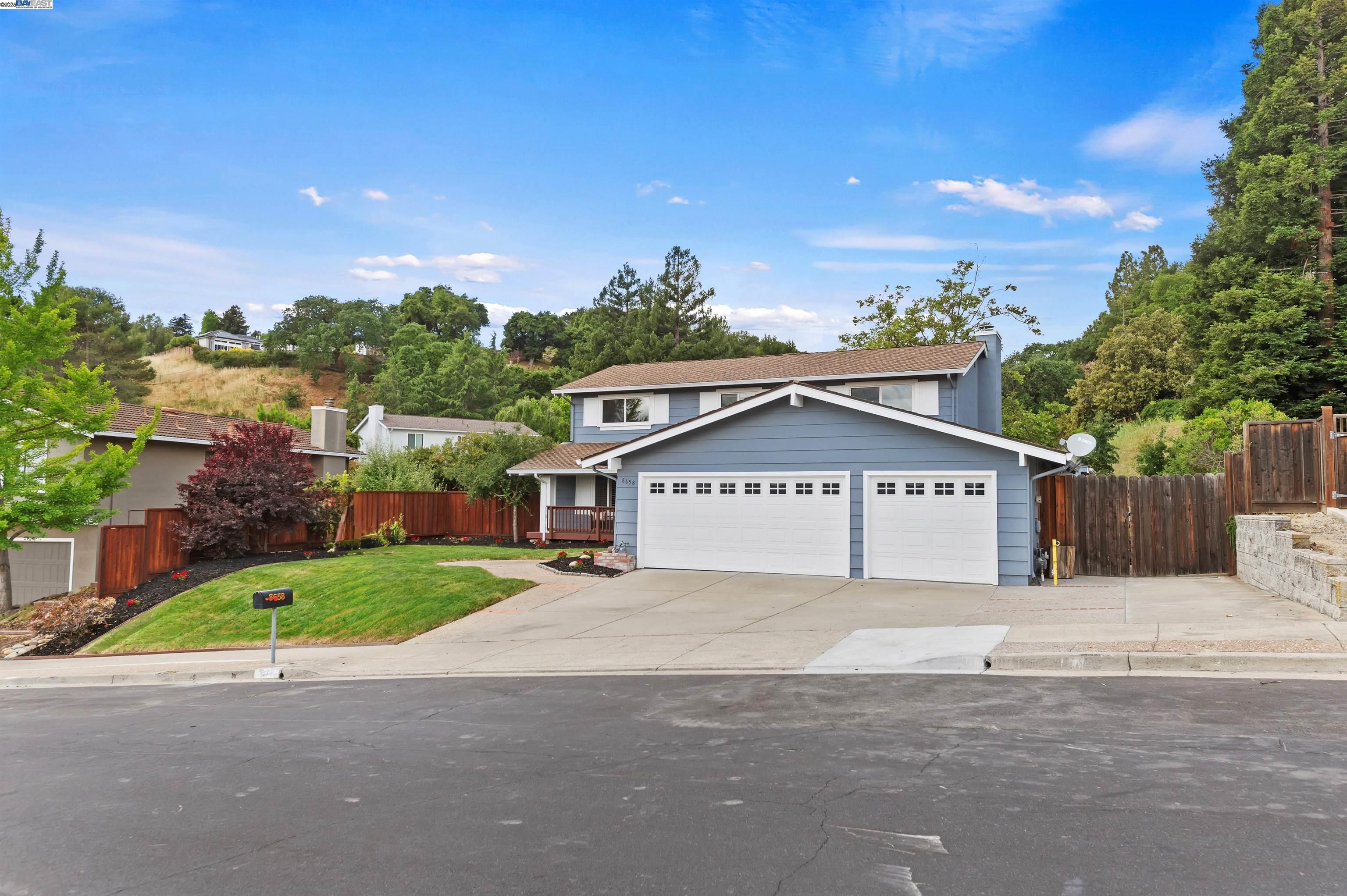 Beautifully updated 5-bedroom home on a private ½ acre lot with brand new landscaping! Enjoy a full bedroom and bath downstairs—perfect for guests or multigenerational living. Fresh interior paint and new carpet throughout. The kitchen features granite counters and stainless steel appliances, opening to a spacious family room with a cozy fireplace and sliding doors that lead to a serene backyard with new sod, fresh landscaping, and potential for an ADU. Upstairs you'll find four generously sized bedrooms with views, including a spacious primary suite with two closets, double sinks, and a large dressing area. Additional highlights include a downstairs laundry room and a 3-car garage. Ideally located near 580/680 freeways, BART, shopping, top-rated schools, and more!