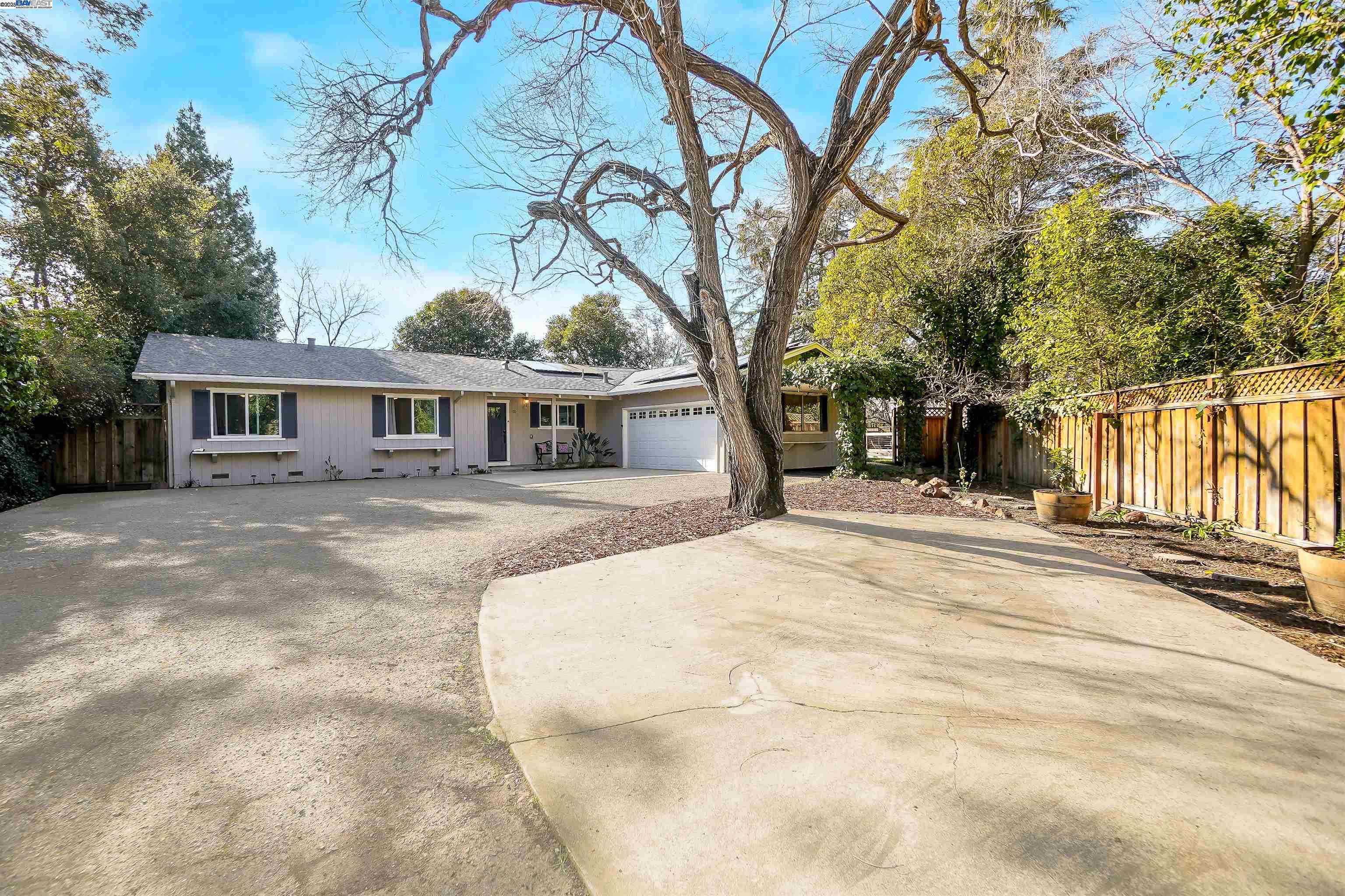 Experience the tranquility of a private estate in Walnut Creek. This 3-bed, 2-bath ranch-style home, nestled on a large, secluded lot, offers 360° privacy. Set back from the street, it's a peaceful retreat. Inside, an open floor plan flows seamlessly, featuring a dedicated office & indoor laundry. Enjoy a sparkling pool & a park-like backyard, beautifully landscaped & ready for enjoyment. 2-car garage & ample parking, with plenty of space for RV parking. Upgrades include: New roof, windows, master bedroom sliding door, interior paint, pool booster pump, pool fence, deer/dog-proof garden fence, dishwasher, washing machine, solar, and EV charging. Conveniently located to excellent schools, transportation routes, and all amenities, this home is perfect for both everyday living and entertaining alike. Desirable Bancroft Elementary School. Located in a quiet, desirable neighborhood in affordable Walnut Creek.