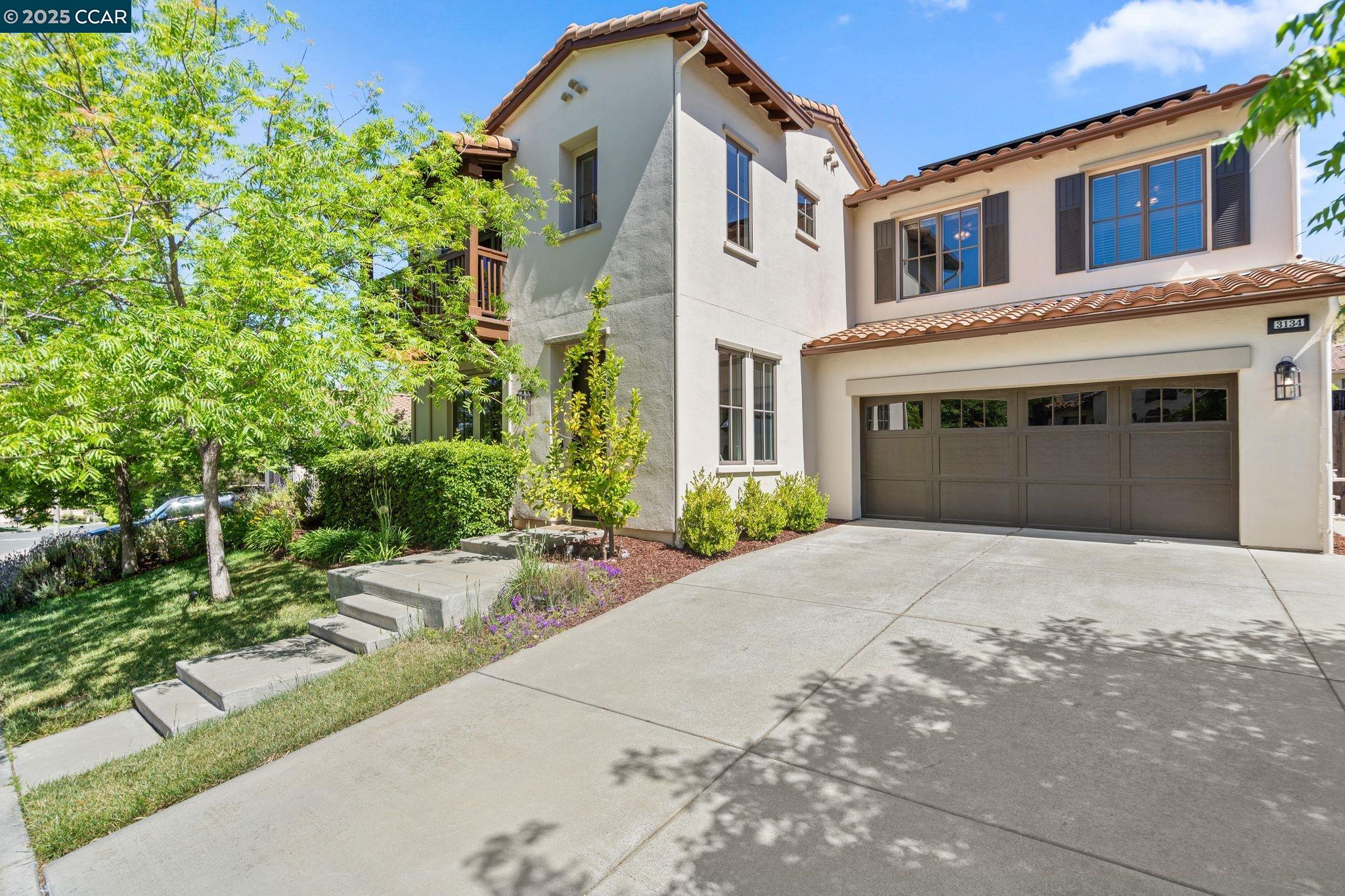 Located in prestigious Rancho Solano, 3134 Olympic Road is a stunning Spanish-influenced home blending timeless charm with modern upgrades. The open floor plan is filled with natural light from high ceilings and expansive windows, while rich LVP floors and exposed beams add warmth and character. The gourmet kitchen features a Sub-Zero fridge, double ovens, and a large center island, offering seamless indoor-outdoor living with the spacious outdoor kitchen. The main level includes a Junior Suite with sitting room—ideal for multi-generational living. Upstairs, the primary suite offers a spa-like bath with soaking tub and walk-in closet, while three additional bedrooms and a loft provide flexible living space.  Step outside to your private backyard oasis with a custom pergola, firepit, 6-person hot tub, terraced lounge area, and professionally landscaped grounds. Fruit trees—including apple, lemon, pomegranate, and olive—thrive year-round. Additional conveniences include owned solar, Nest thermostats, Ring security and more.  Prime location near Napa and Suisun Valley wineries, Lake Tahoe getaways, and just 45 minutes to San Francisco. Rancho Solano amenities include a championship golf course, clubhouse, gym, tennis courts, and an Olympic-sized pool. Live the Rancho Solano dream!